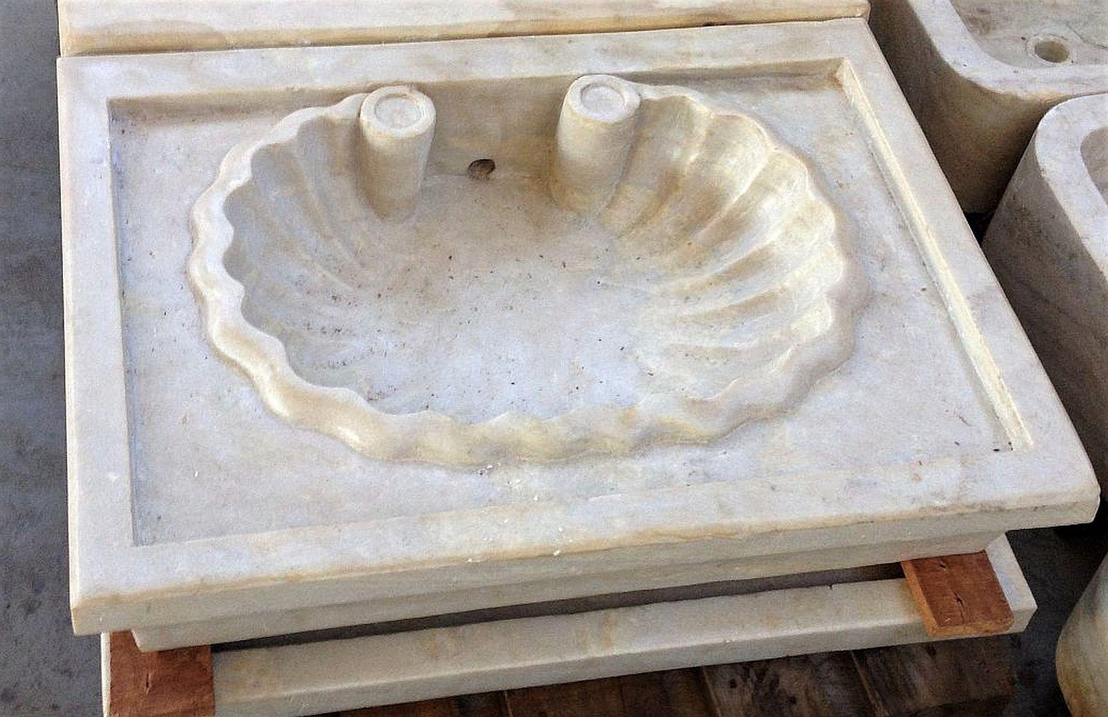 This timeless beautiful Italian classical sink is cut from one single block of white Carrara marble, the design with a set in shell style is taken from Greek and Roman times, the piece carries superb artistic merit easily fitting in with old and new