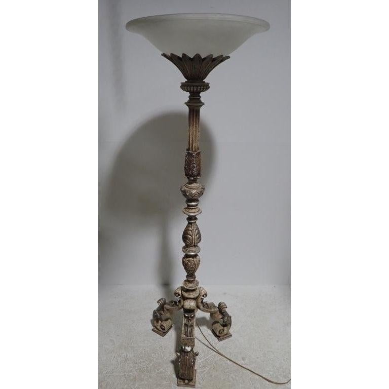 Classical carved figurative rococo floor lamp torchiere with frosted glass shade. Silver leaf torchiere with ornate design and crackle finish.