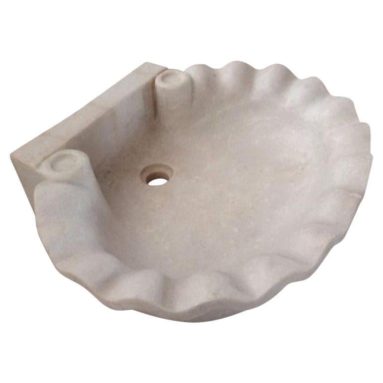 This timeless beautiful Italian classical sink is cut from one single block of white marble, these designs have not changed since Greek and Roman times, it carries superb artistic merit easily fitting in with old and new buildings. 
Just under 24