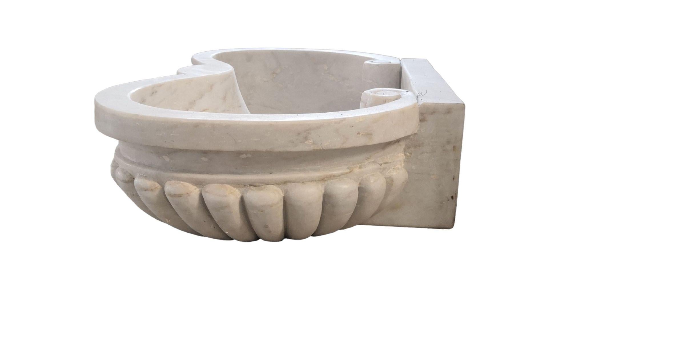 This timeless beautiful Italian classical sink is cut from one single block of white marble, these designs have not changed since Greek and Roman times, it carries superb artistic merit easily fitting in with old and new buildings. 
It can also