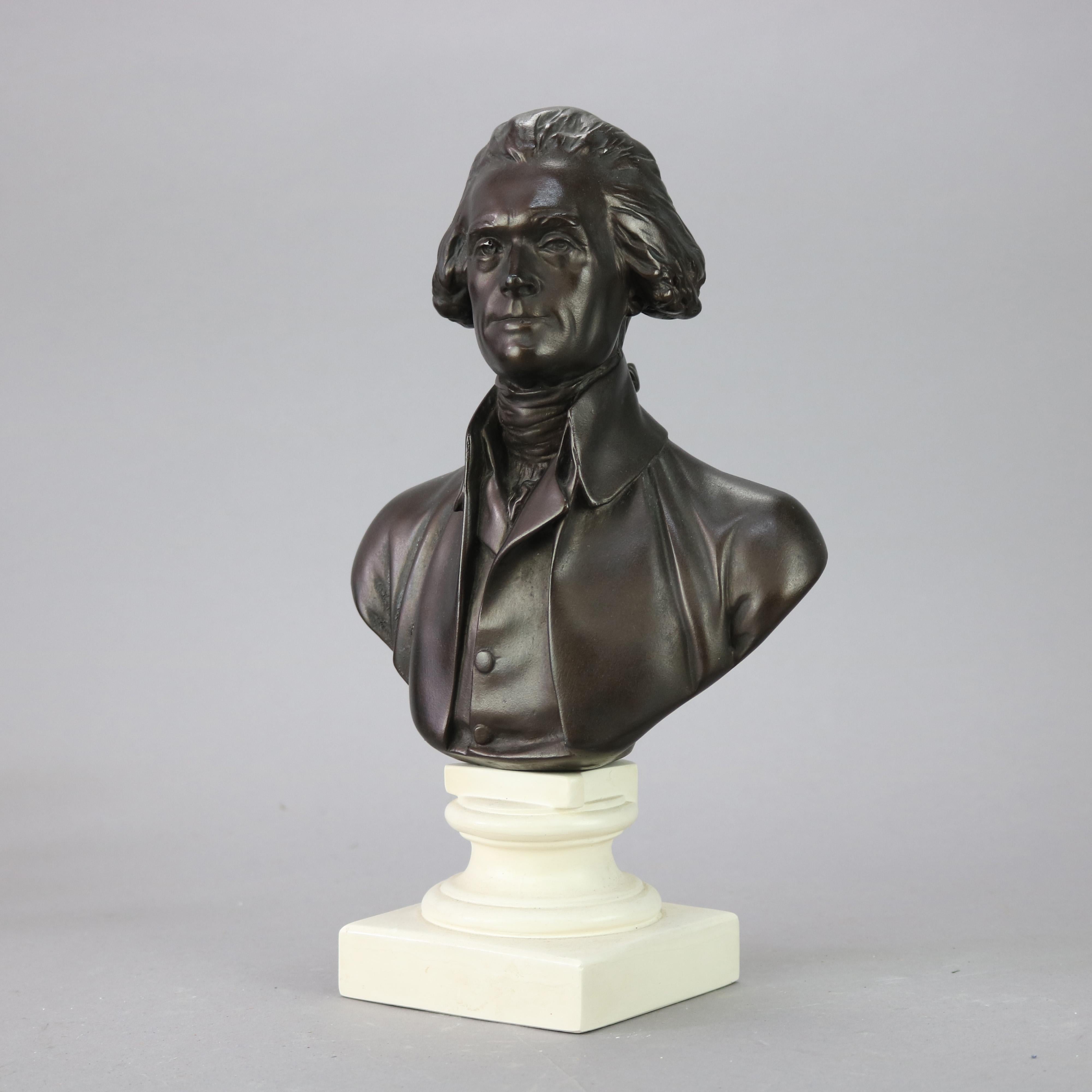 A Classical cast and bronzed composition bust depicts portrait of President Thomas Jefferson on round plinth, en verso 