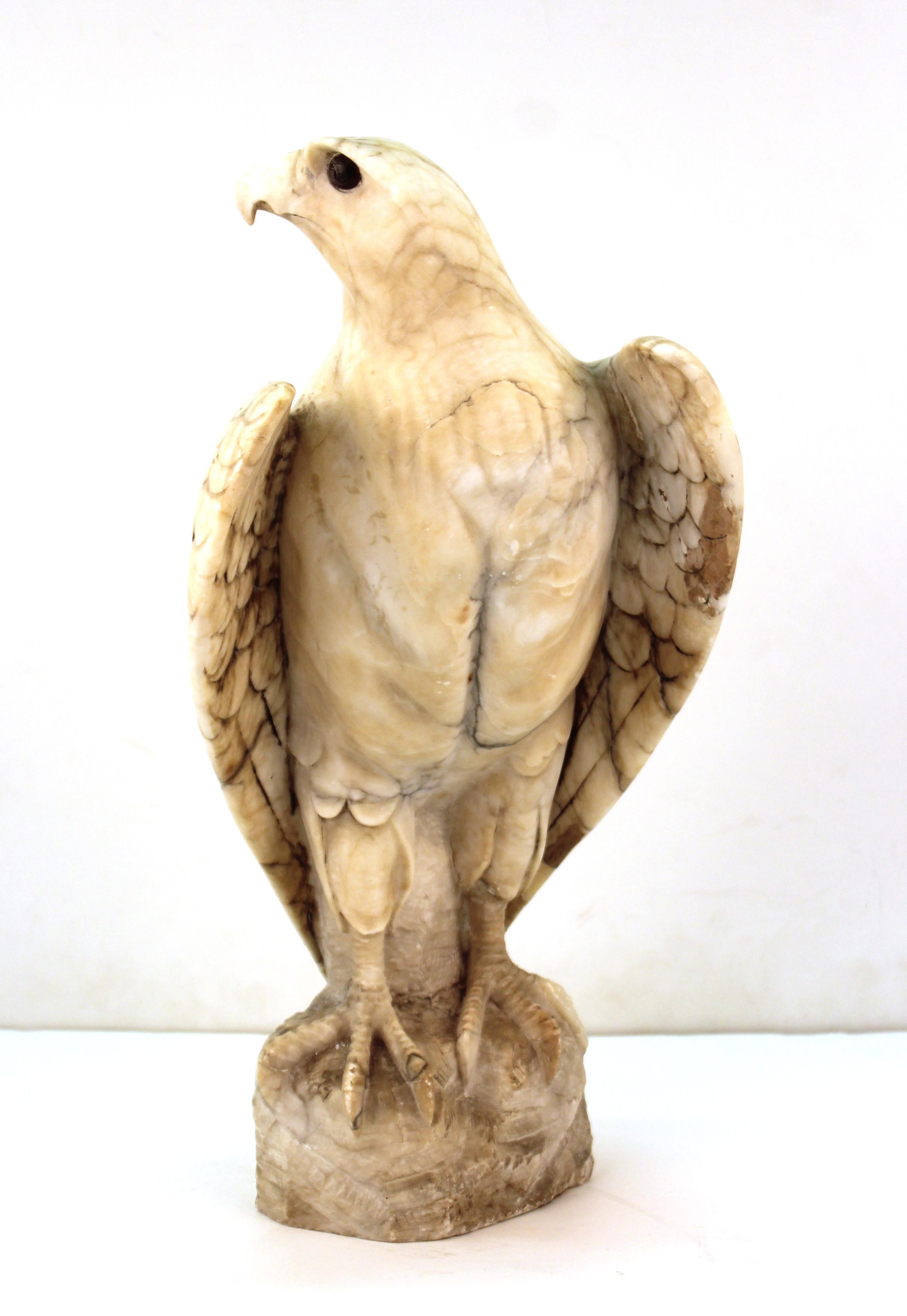 American Classical realist eagle sculpture in carved marble, with eye inserts. The piece is unsigned and has some old repairwork and loss to the proper left leg claw. In great vintage condition with age-appropriate wear and use.
