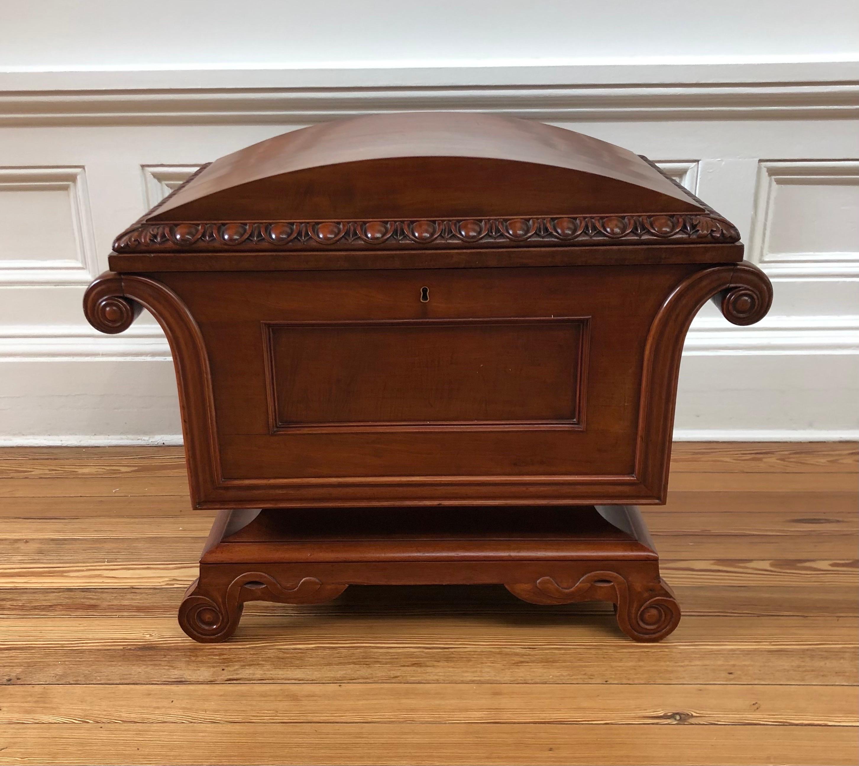 This Classical Regency Sarcophagus Mahogany Dome Top Cellarette / Office File was made in England in the early Nineteenth Century. The Regency Sarcophagus Mahogany Dome Top Cellarette take is a Classical Form from Ancient Greek and Roman