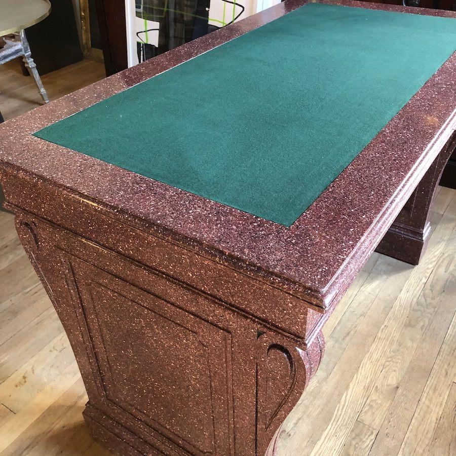 Classical faux porphyry library table
Northern European, 19th century
Measures: Height 31 1/4 in, width 47 1/4 in, depth 25 3/4 in.
2206.