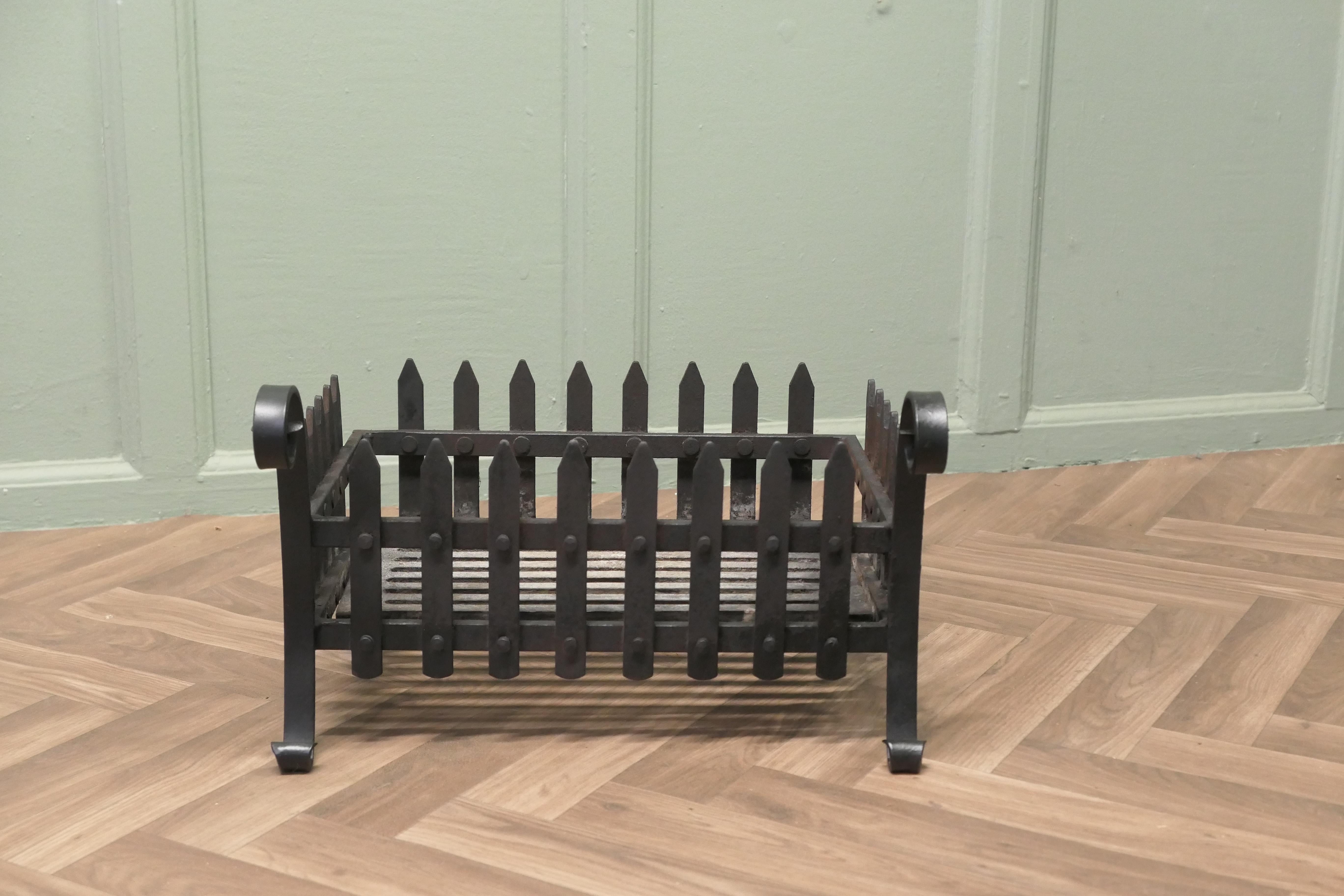 Classical Free Standing Fire Basket, Iron Fire Grate

The grate has cast and wrought iron rails all around with an iron grate at the base and ram’s horn twits at the front
The basket is in good used condition, it measures 17” long  14” deep and 11”