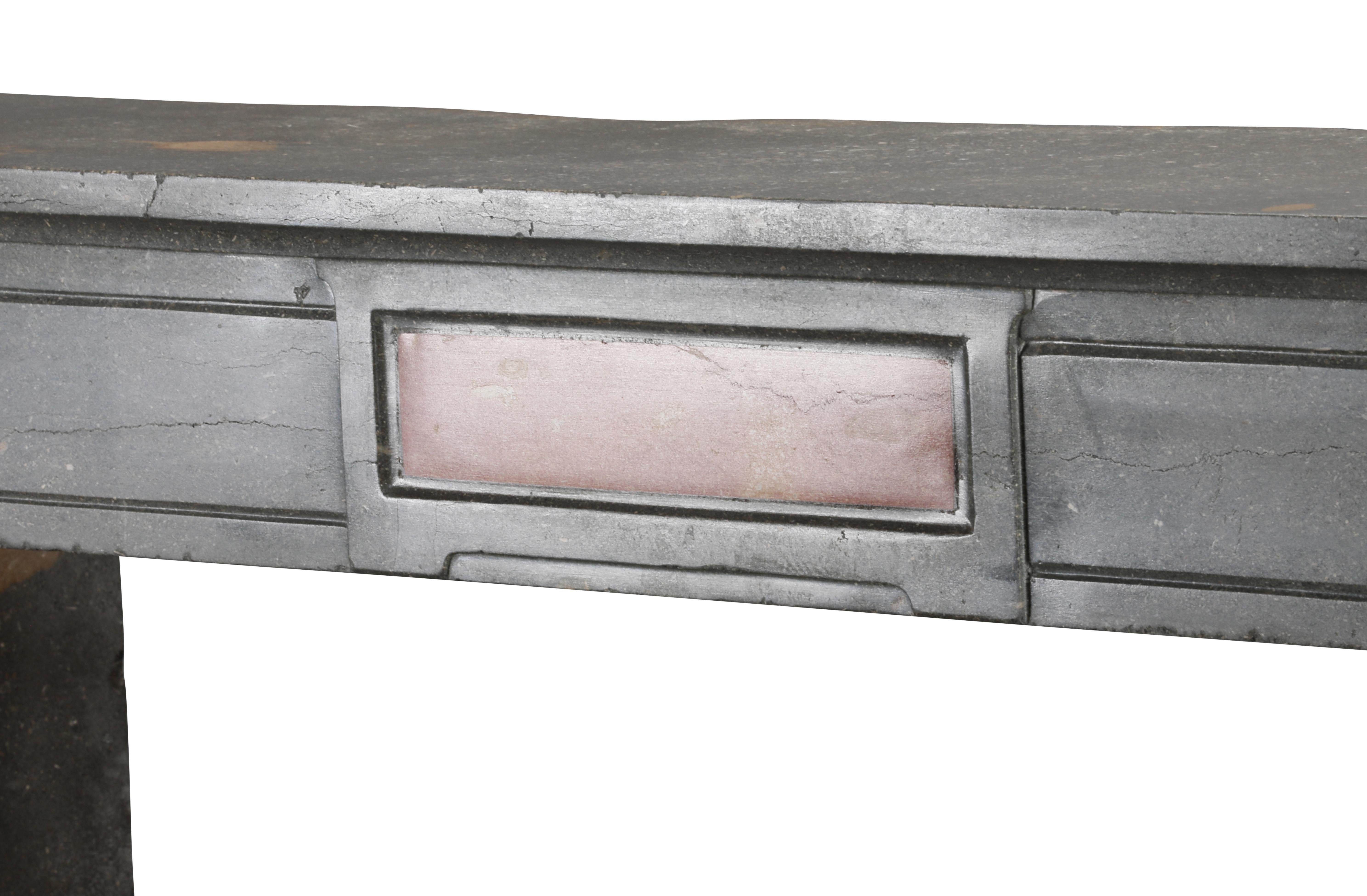Classical French Antique Fireplace Mantel in Grey-Green Stone With Warm Accents For Sale 2