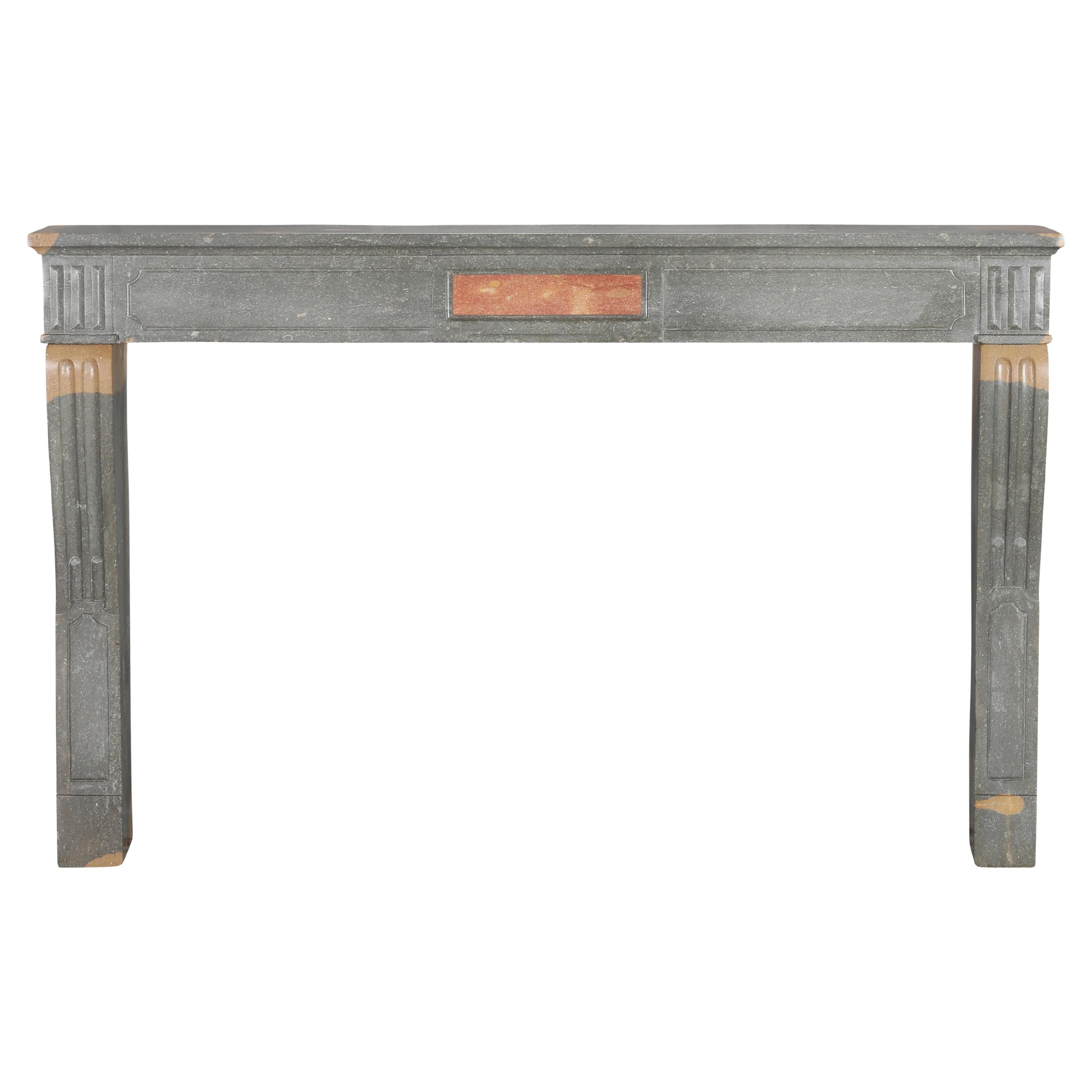 Classical French Antique Fireplace Mantel in Grey-Green Stone With Warm Accents For Sale