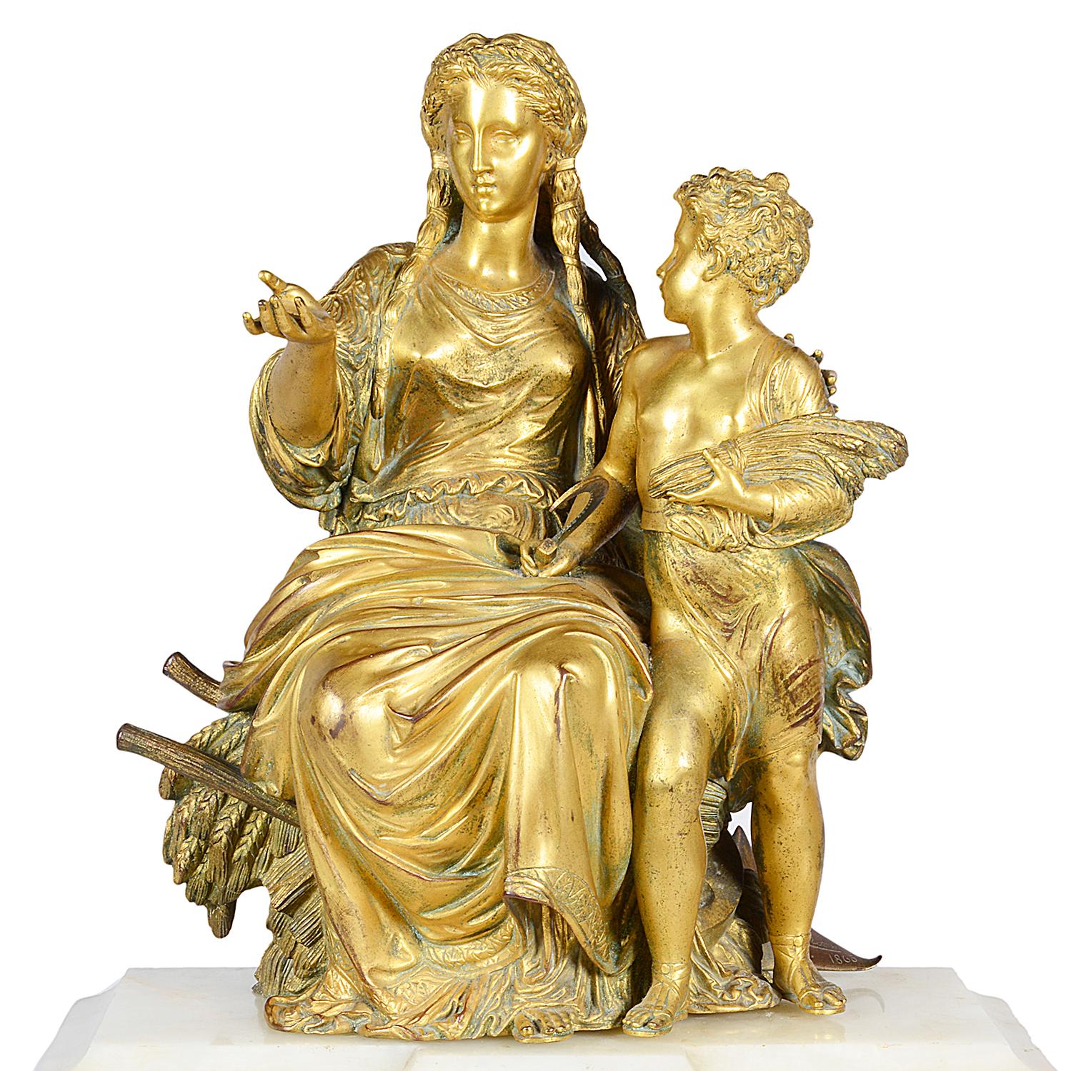 A very good quality 19th century French Louis XVI style gilded ormolu and marble mantel clock, depicting a mother and child after harvesting above an eight day duration chiming clock, either side having classical Roman bust plaques raised on a