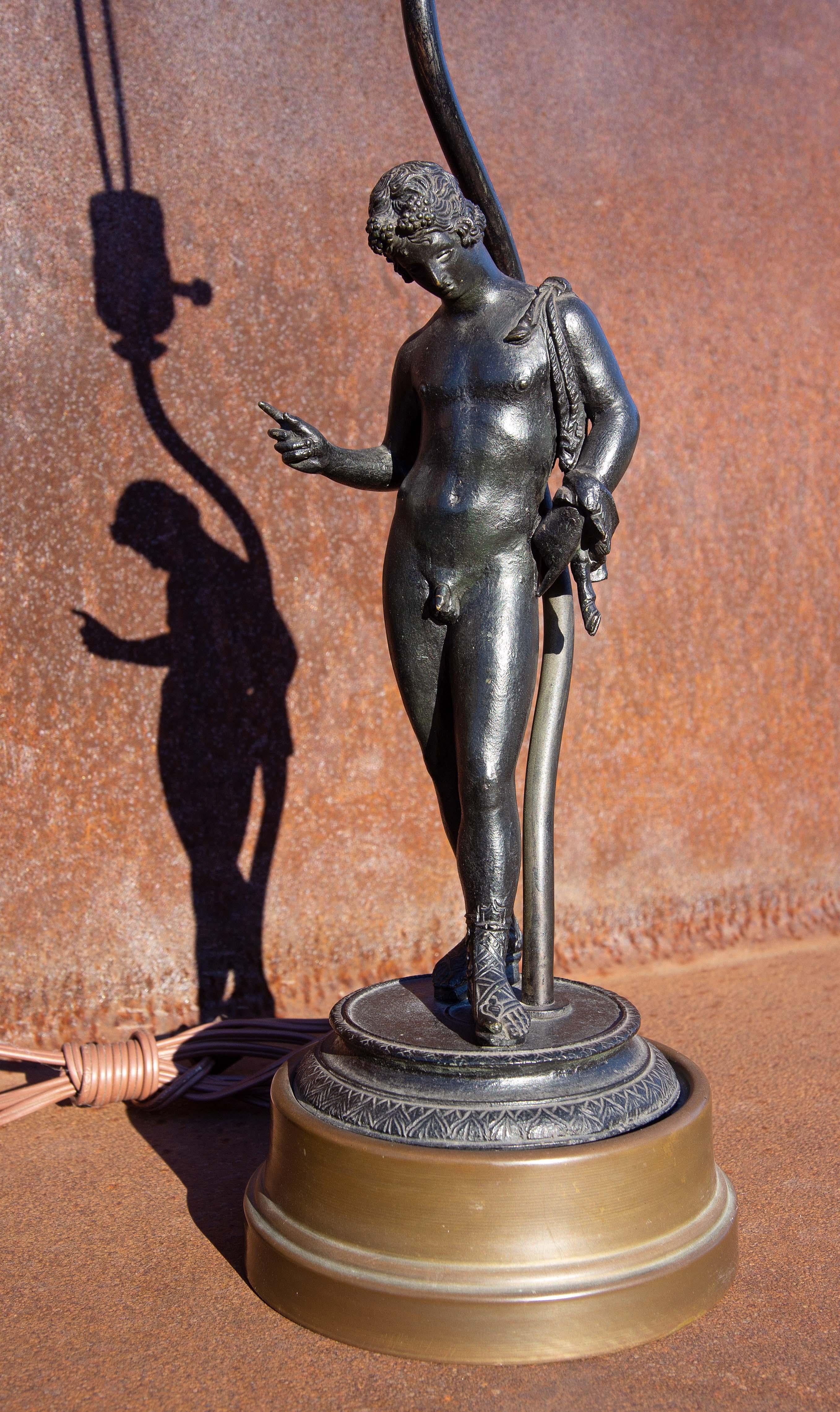 Grand Tour 19th century bronze sculpture of Narcissus after the original found in 1862 at Pompeii. When first found in Pompeii it was identified as Narcissus. Years later it was identified as Dionysus. Mounted as a lamp. Early 20th century.