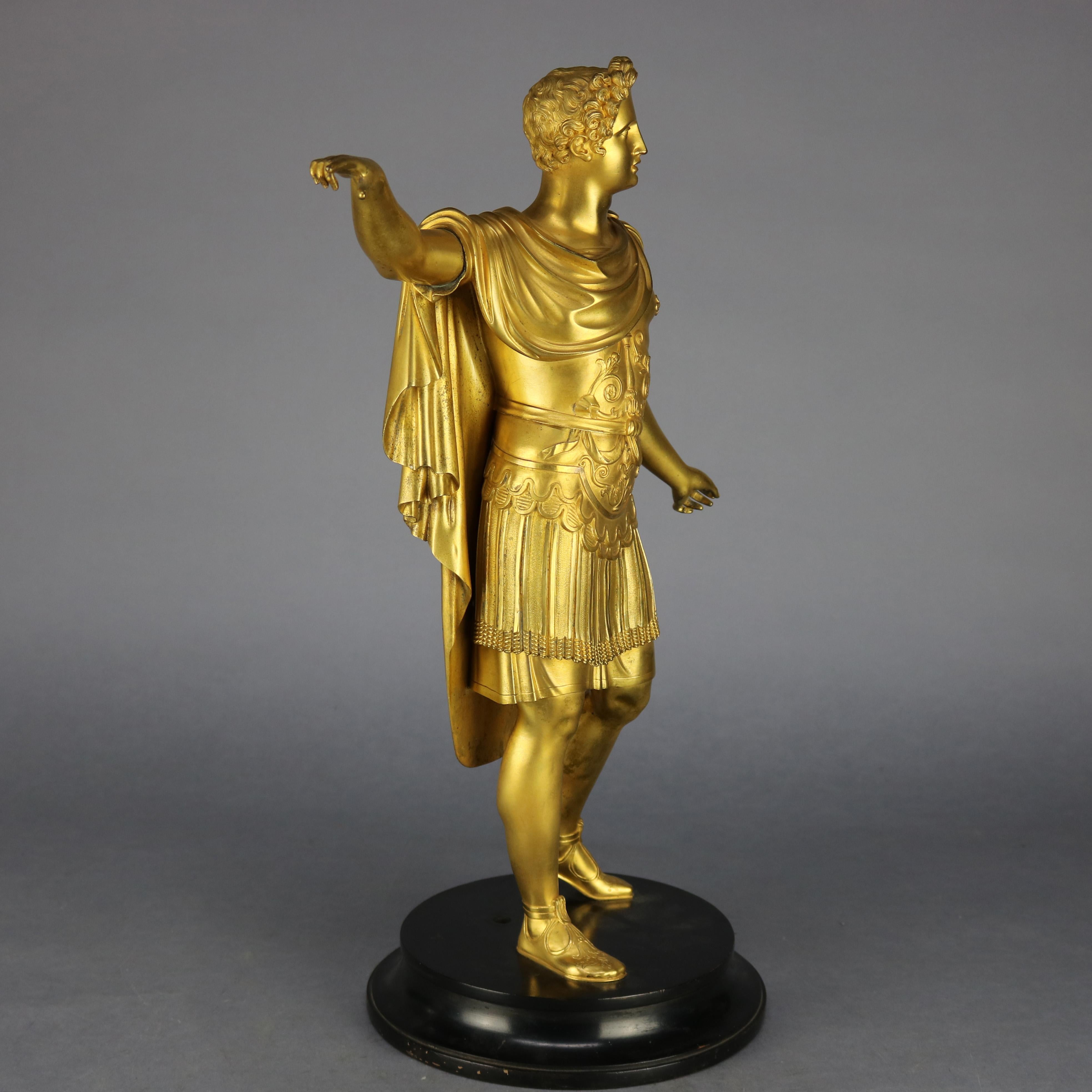 An antique Classical Grand Tour sculpture offers gilt cast bronze construction with full length portrait sculpture of Greek or Roman emperor, seated on marble plinth, 19th century.

Measures: 20.75