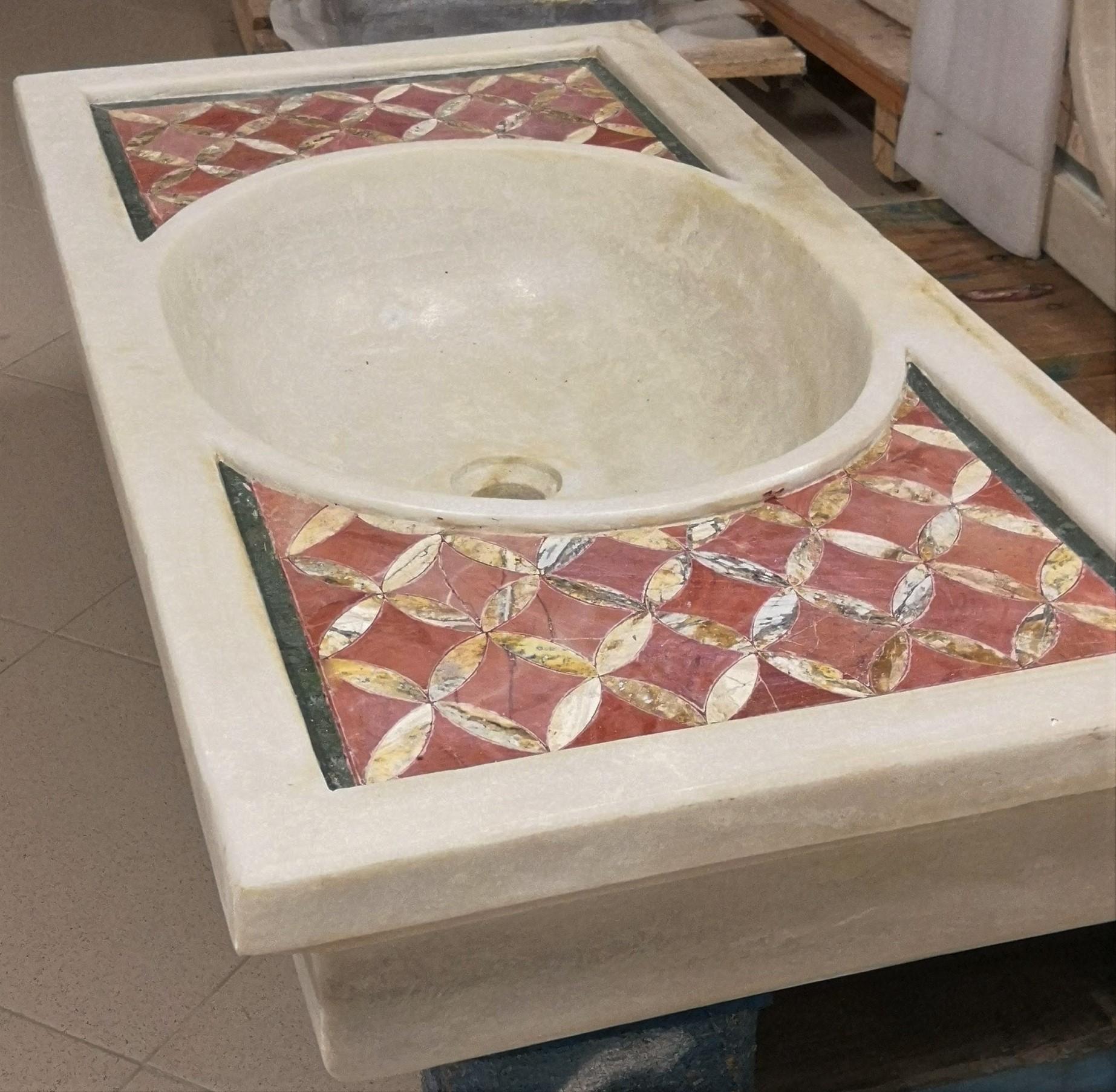 This timeless beautiful Italian classical sink is cut from one single block of white marble with poly chrome inlays, the straight fronted format has fine rhombus inlaid details enclosed
with an ebonised border, the lower sections are traditionally