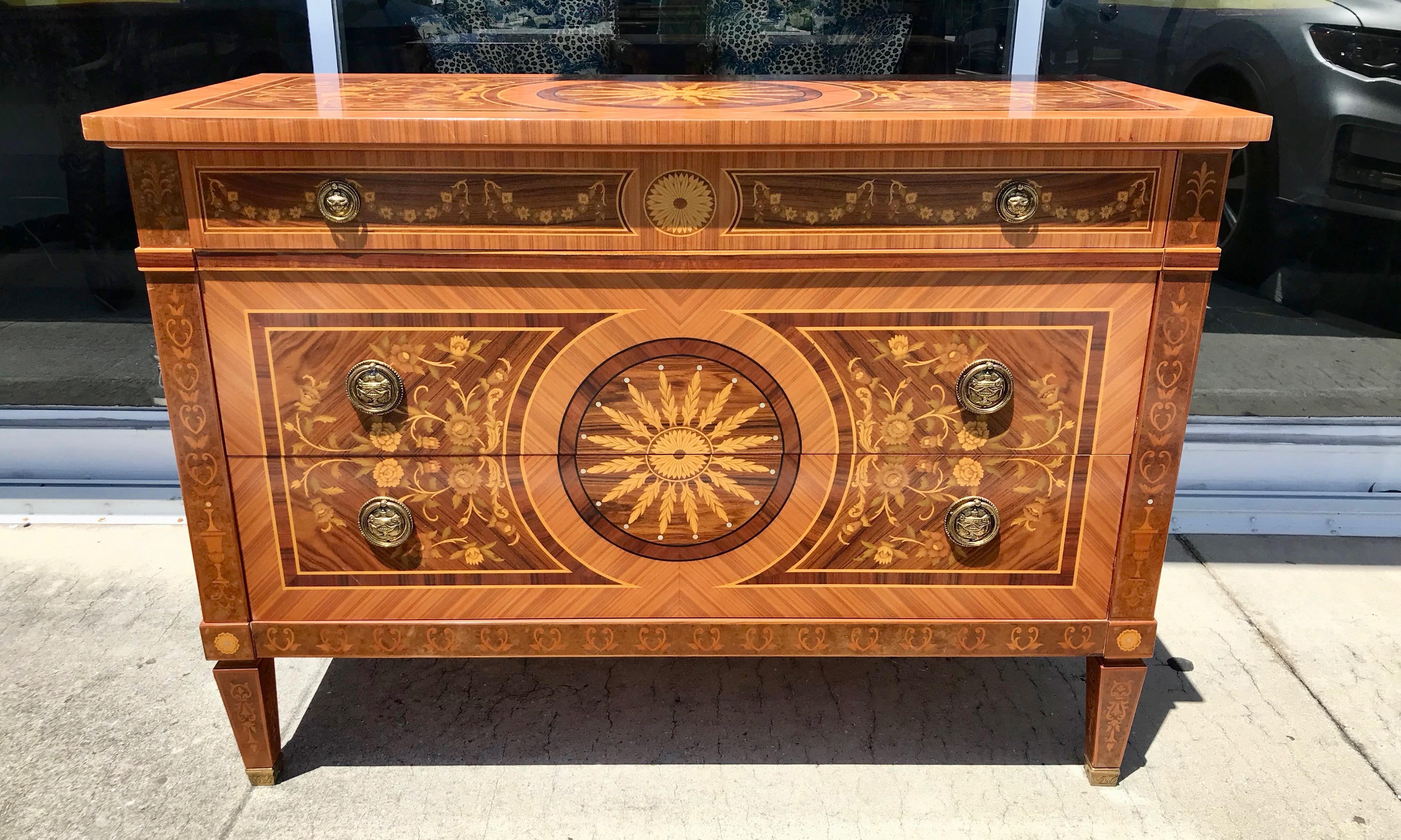 Exquisitely inlaid with various fruitwoods of magnificent scale and proportions.
The piece features a central sunburst with adjacent foliate embellishments .
In addition, the sides are inlaid with an abundance of florals.
A central 