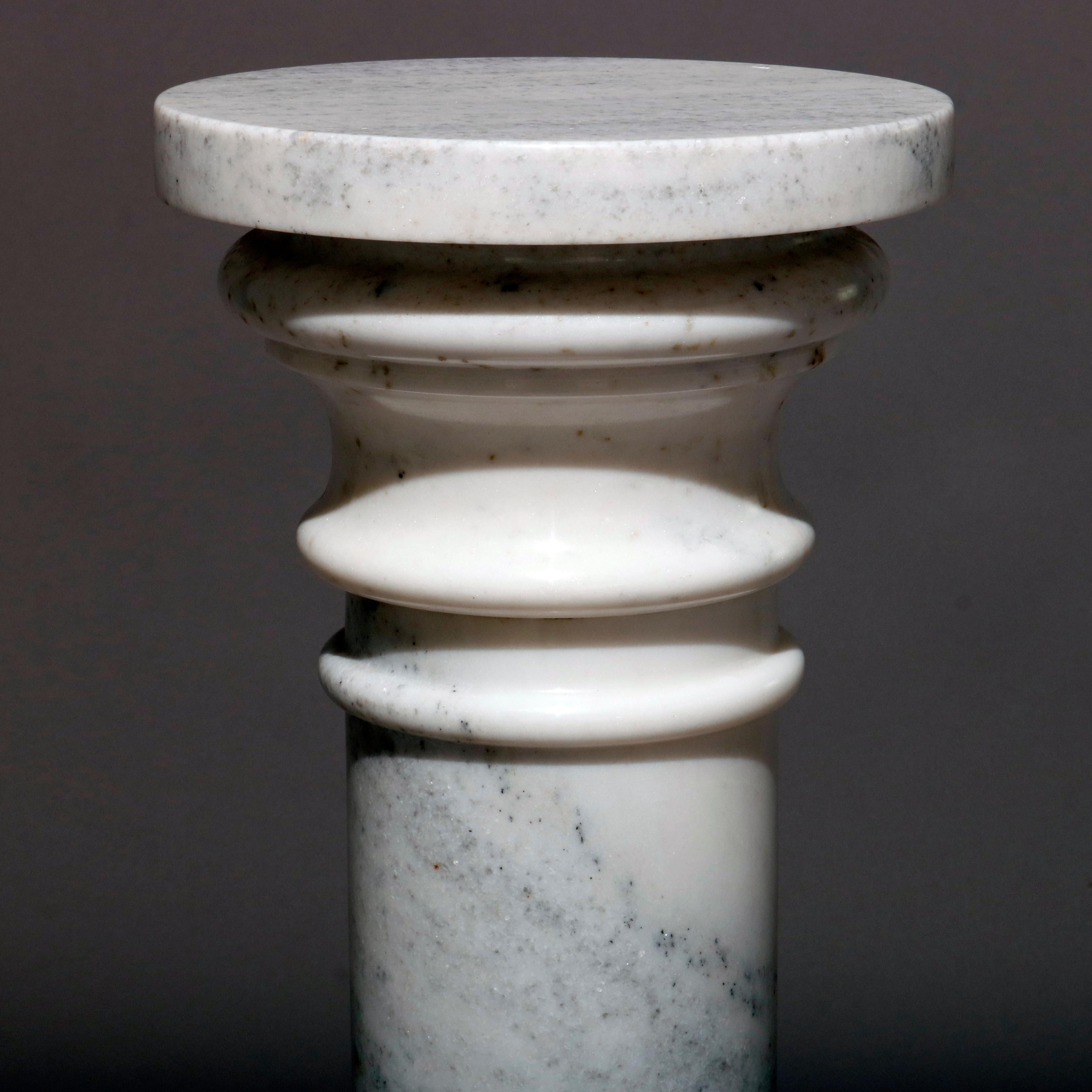 A classical Italian marble sculpture display pedestal features Doric column form with stepped base and display, 20th century

Measures: 32