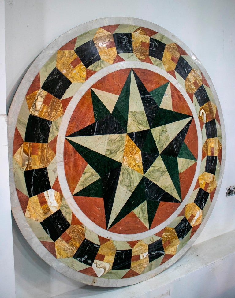 Classical Italian Pietra Dura compass rose mosaic round white marble tabletop handcrafted with serpentine green, Alicante red, Nero black, travertine and other marbles.
 