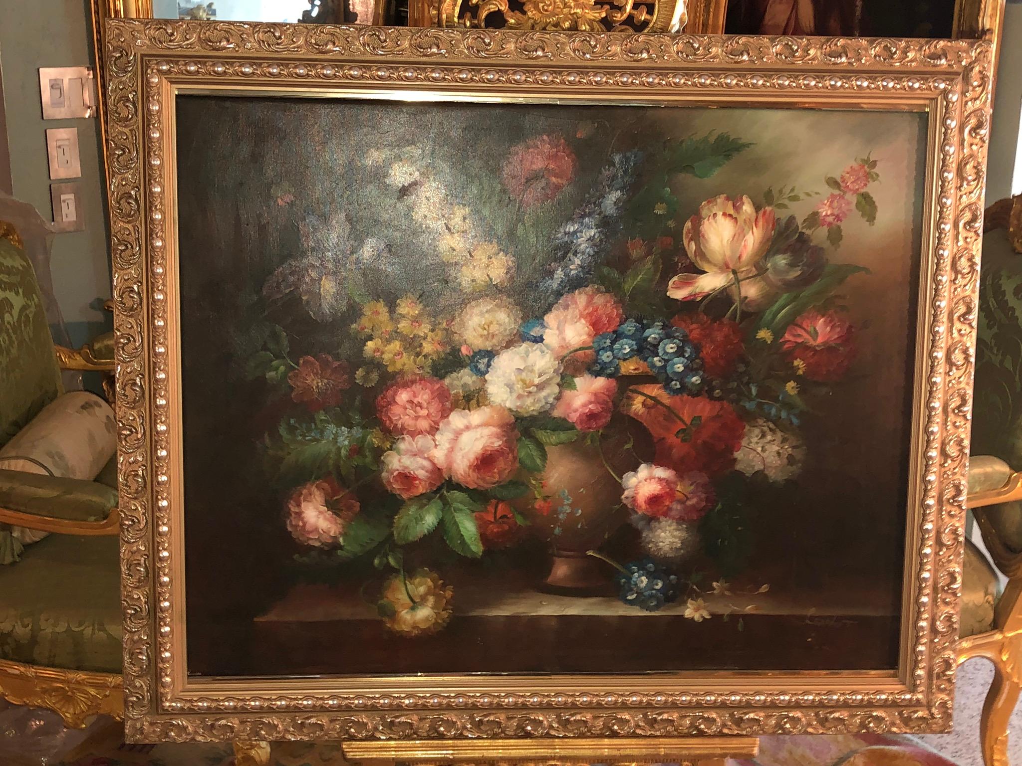 This large (signed) oil painting, is a truly beautiful floral display in paint, richly colored in various shades of peach, pink, cream, blues, yellow, orange, lavender and green making for a large burst of elegant color.
Peonies, bluebells, iris,