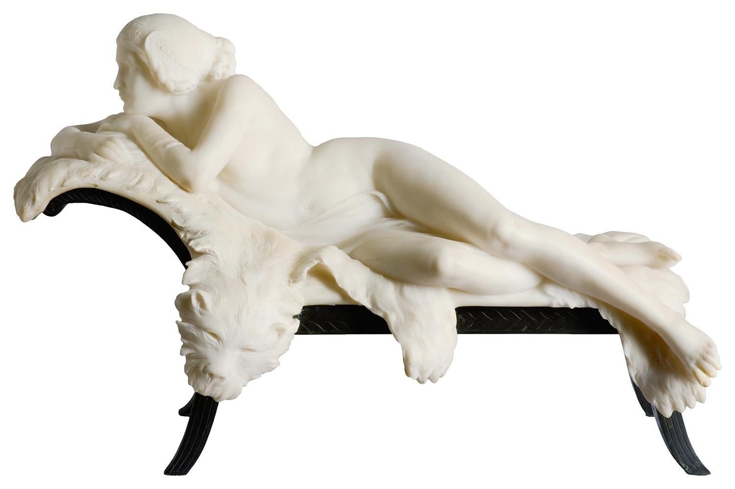 A fine quality late 19th century French marble statue of a classical female nude reclining on a tigers skin and bronze daybed.
Signed: G Gomlags.