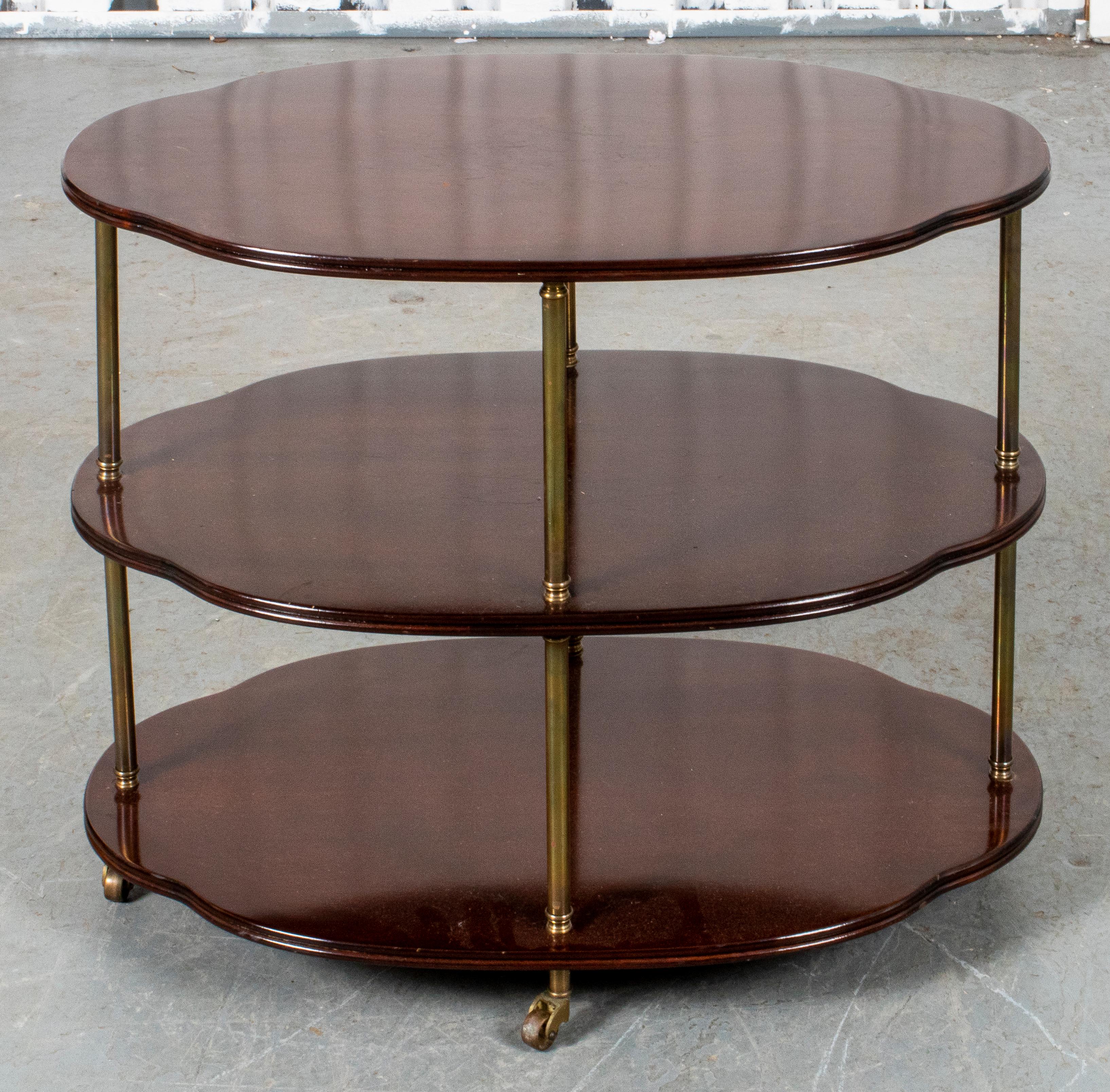 Classical manner diminutive serving table with three oval levels, on casters.