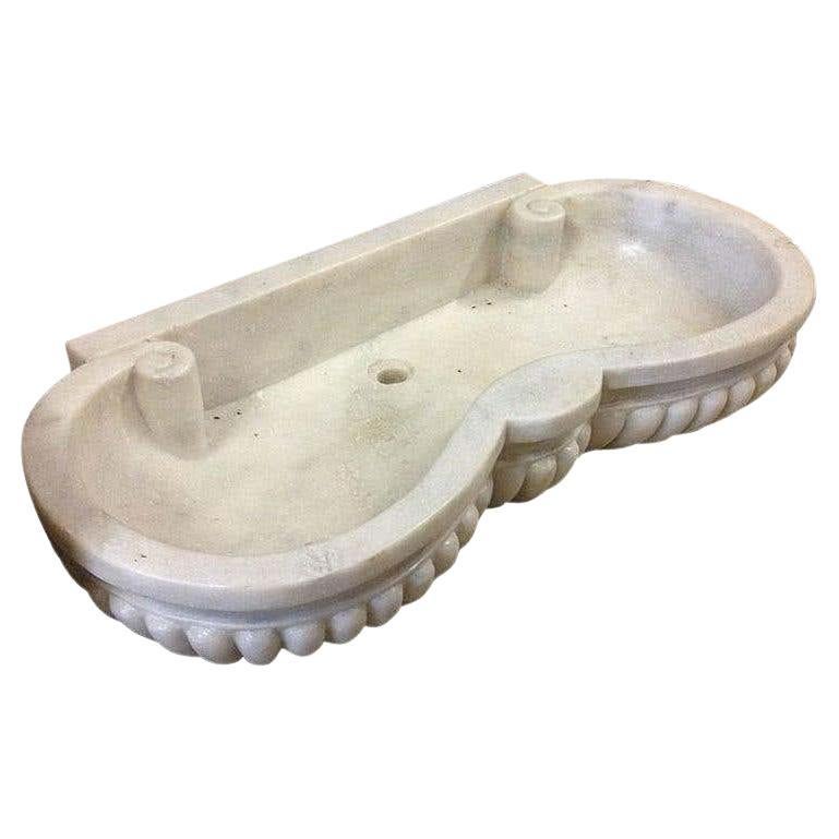 Classical Italian sink basin cut from one single block of white marble with serpentine shaped front and gadrooned carving, these Greek/Roman designs quite happily suit either old or new properties.


 