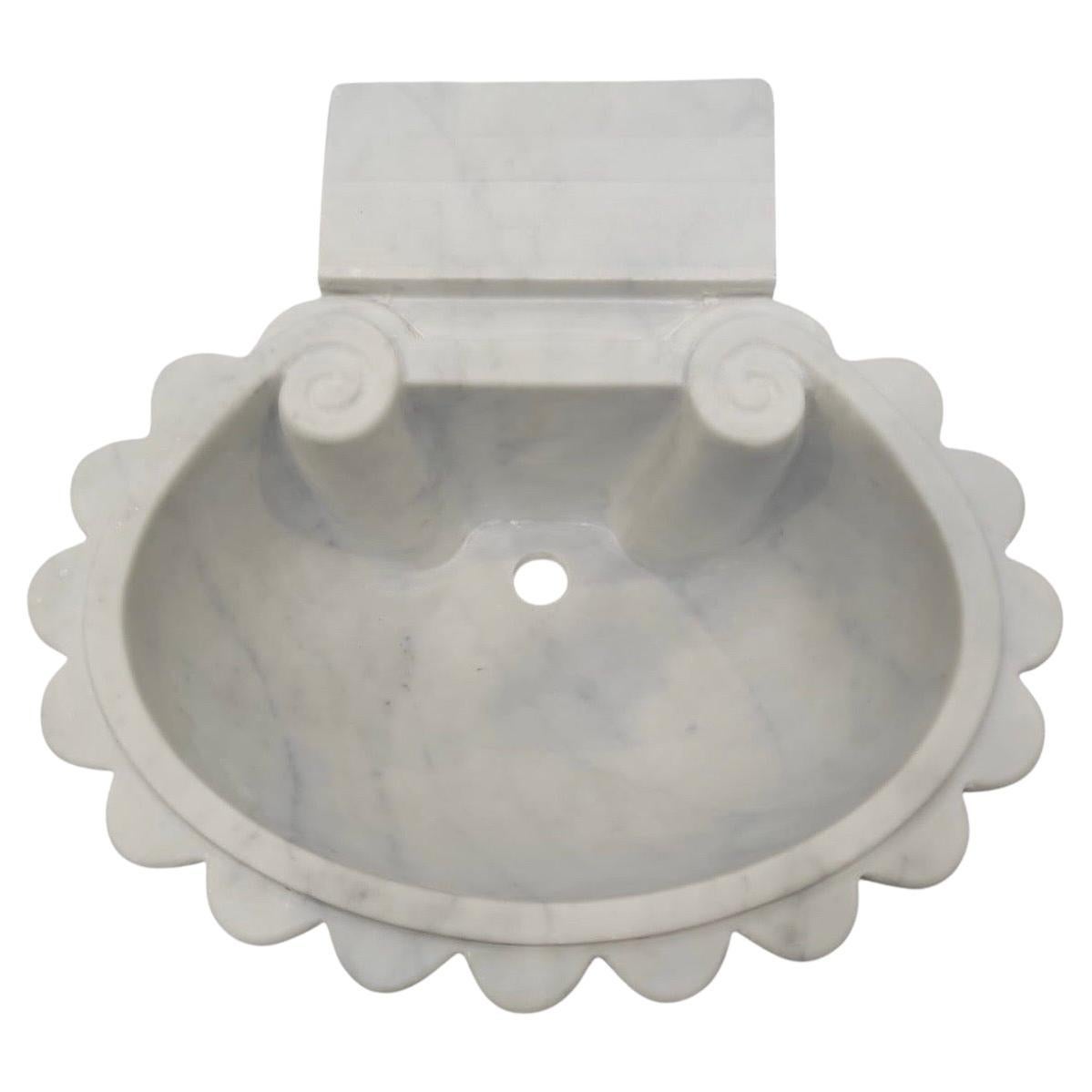 This timeless beautiful Italian classical sink is cut from one single block of white marble, these designs have not changed since Greek and Roman times, it carries superb artistic merit easily fitting in with old and new buildings. 

