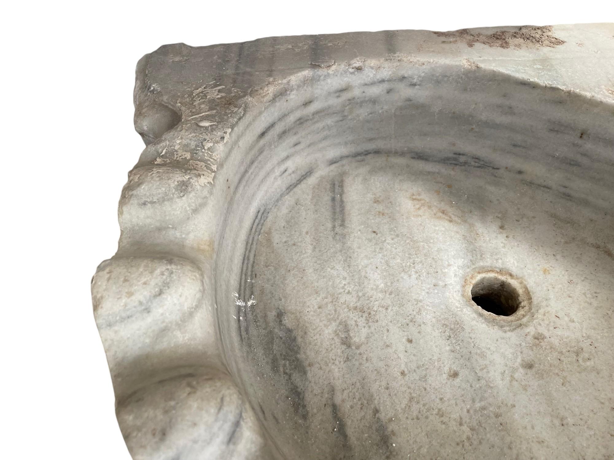 Marble Corner Stone Sink
Naturally distressed marble, an original rare period piece
the wavy front design with useful corner spaces
Side 46 cm
Depth 52 cm
Length 63 cm
Internal height 9 cm
External height 13 cm