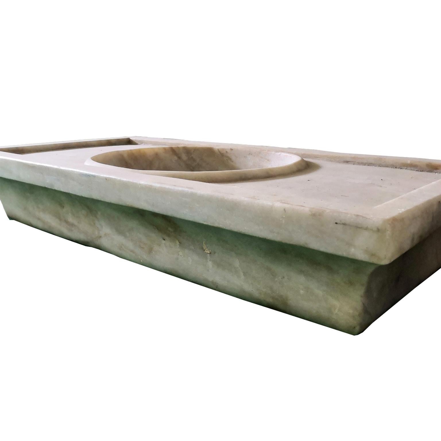 This timeless beautiful Italian classical sink is cut from one single block of white marble, these designs have not changed since Greek and Roman times, it carries superb artistic merit easily fitting in with old and new buildings. It also makes an