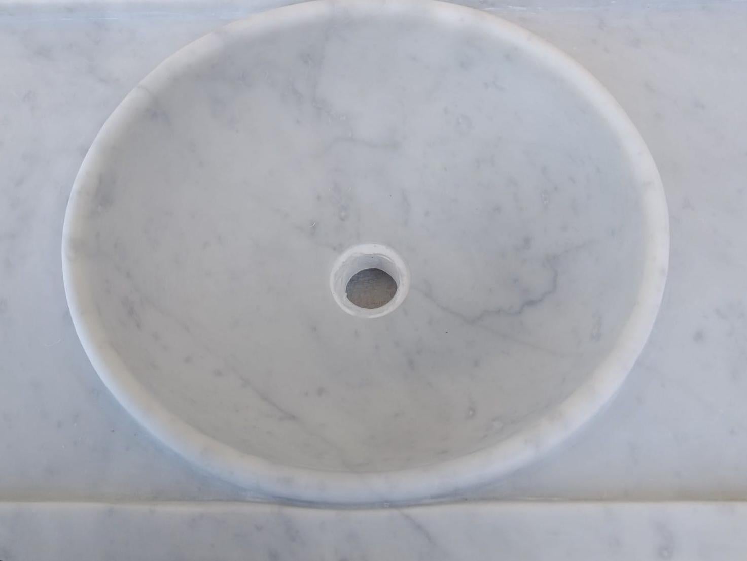 This timeless beautiful Italian classical sink is cut from one single block of white marble, these designs have not changed since Greek and Roman times, it carries superb artistic merit easily fitting in with old and new buildings. It also makes an