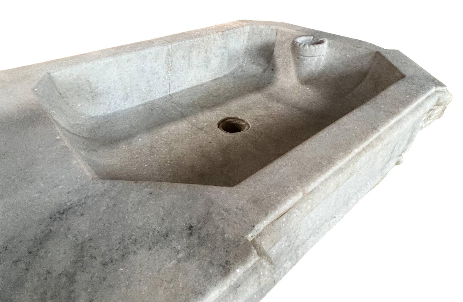 A Period Antique Double Sink with superb proportion and period detailing
made in Carrara marble 
Circa 1850

Width   53.5