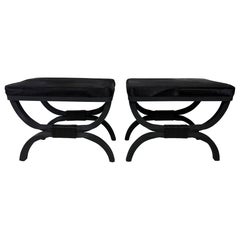 Classical pair of wrought iron benches with cowhide upholstery