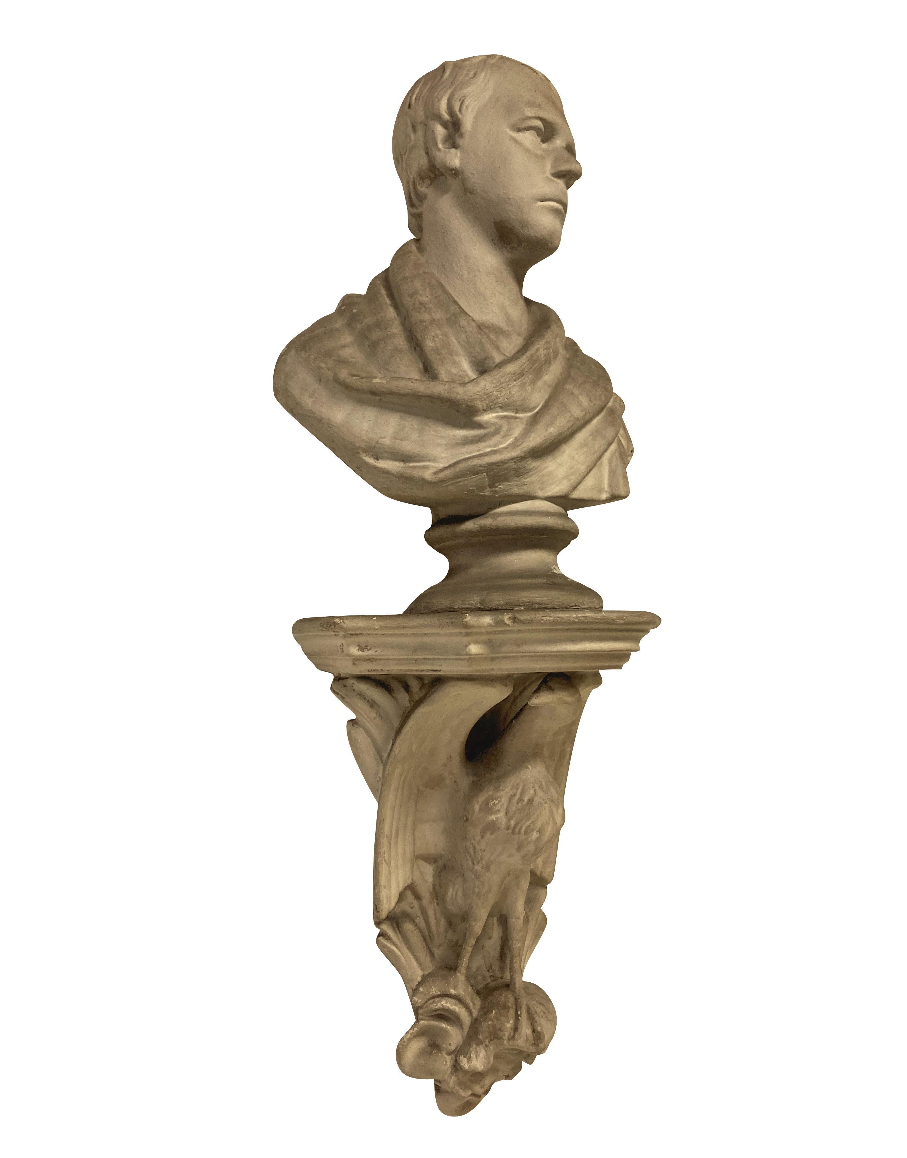 An English Classical plaster library bust of a gentleman in Roman clothing, with a wall bracket depicting a Roman eagle.

Sir Walter Scott after Chantrey.