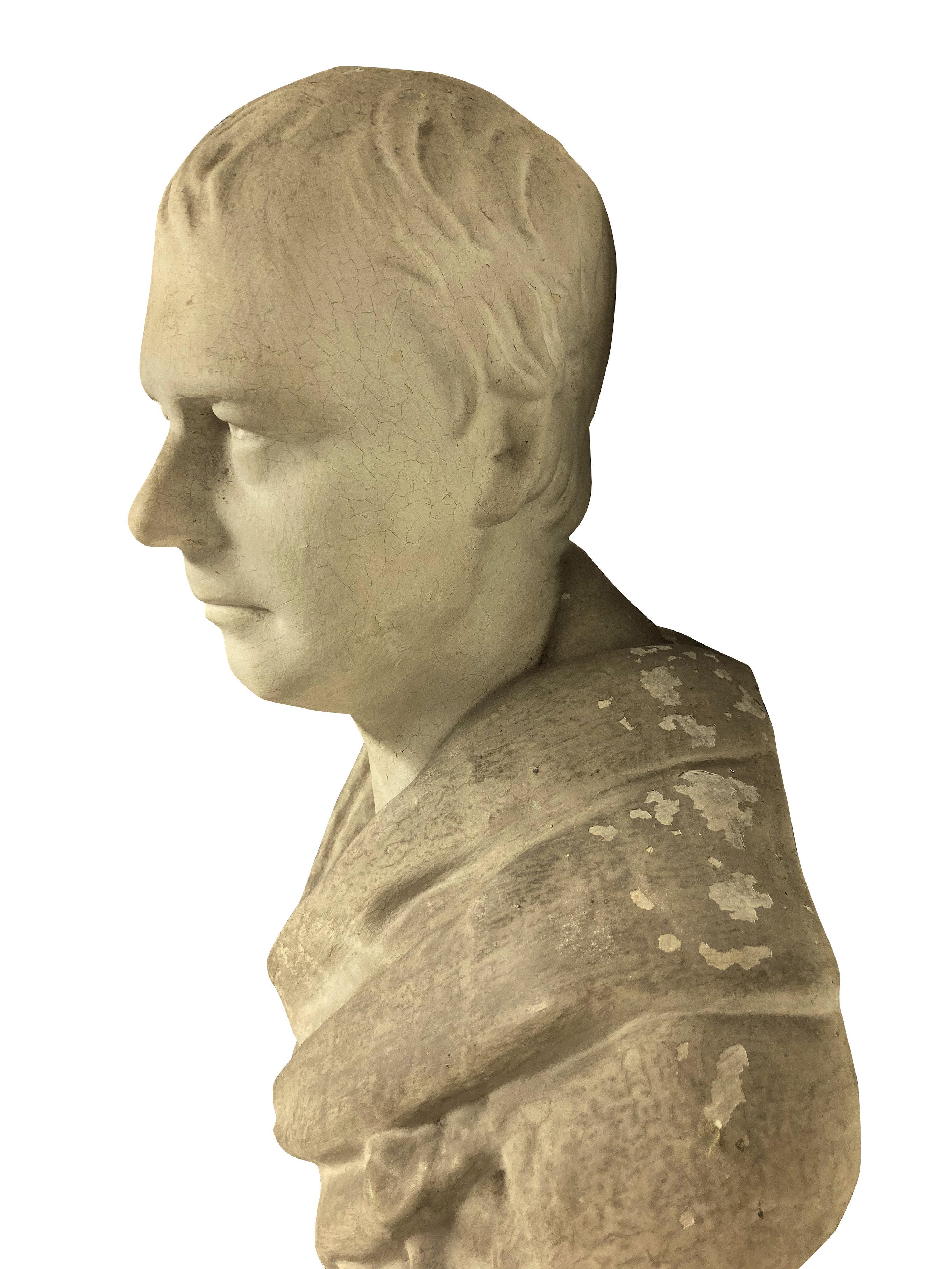 An English classical plaster library bust of a gentleman in Roman clothing, with a wall bracket depicting a Roman eagle.

Sir Walter Scott after Chantrey.
