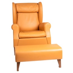 Fauteuil à dos en cuir Poltrona Frau classique avec ottoman assorti