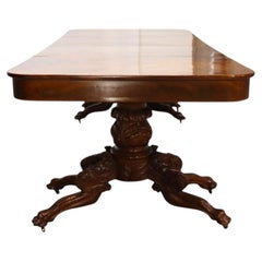 Table de banquet classique en acajou inspirée de Quervelle, à feuilles tombantes et pieds en griffe, vers 1840