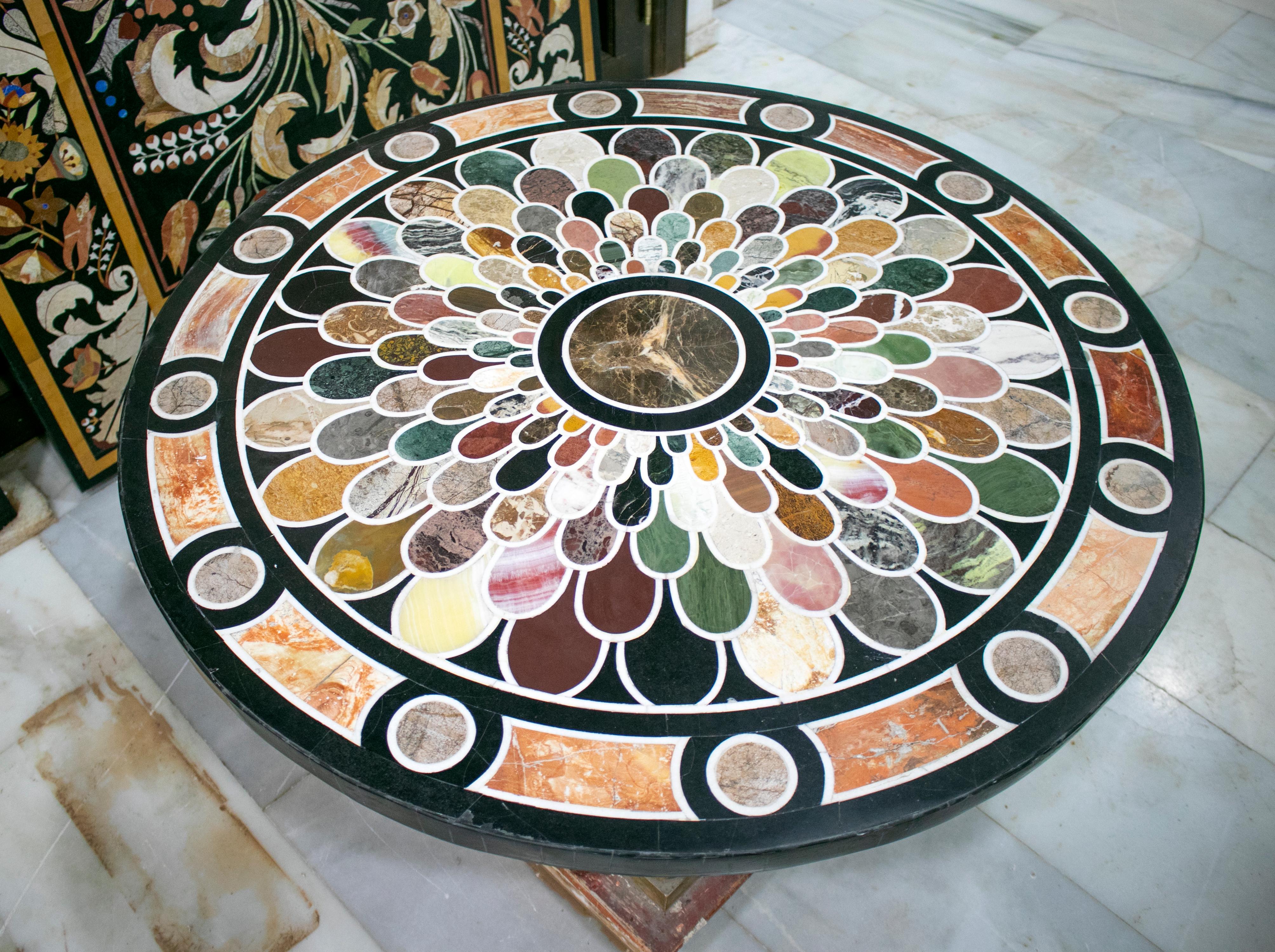 Classical Roman Italian Pietra Dura stone round table top with geometric mosaic inlay handcrafted using an assortment of marbles.