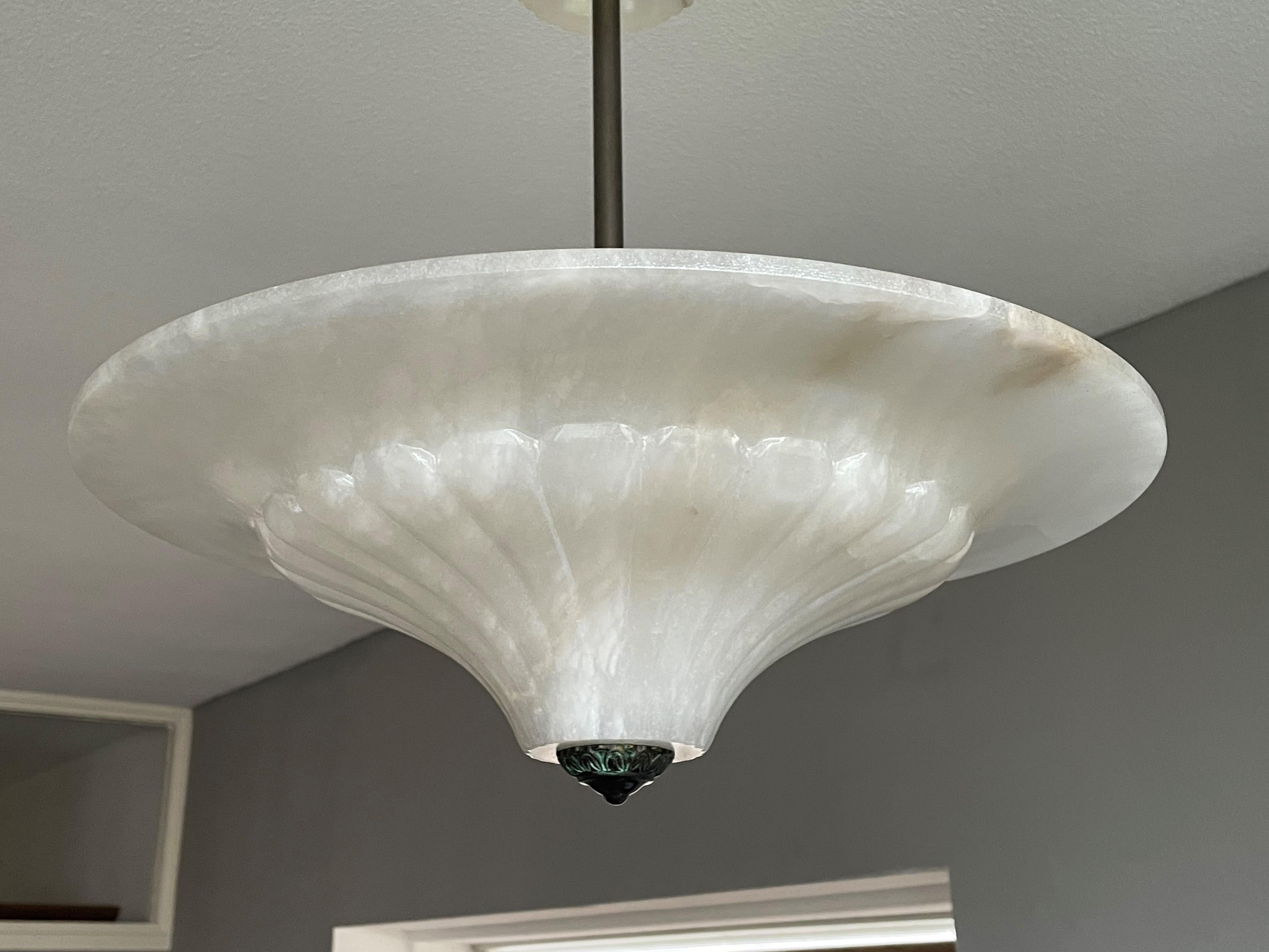 Excellent condition, good size and rare design, 3-light chandelier.

If you like alabaster light fixtures, but you prefer them in this Classical Roman style, then this 1970s lengthy specimen could be perfect for you. The combination of the white