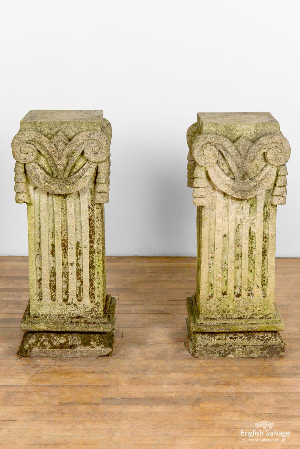 Reclaimed pair of classical style plinths / pedestals / stands with swag detail to the tops and fluting to the columns. Nicely weathered with moss and lichen patina.