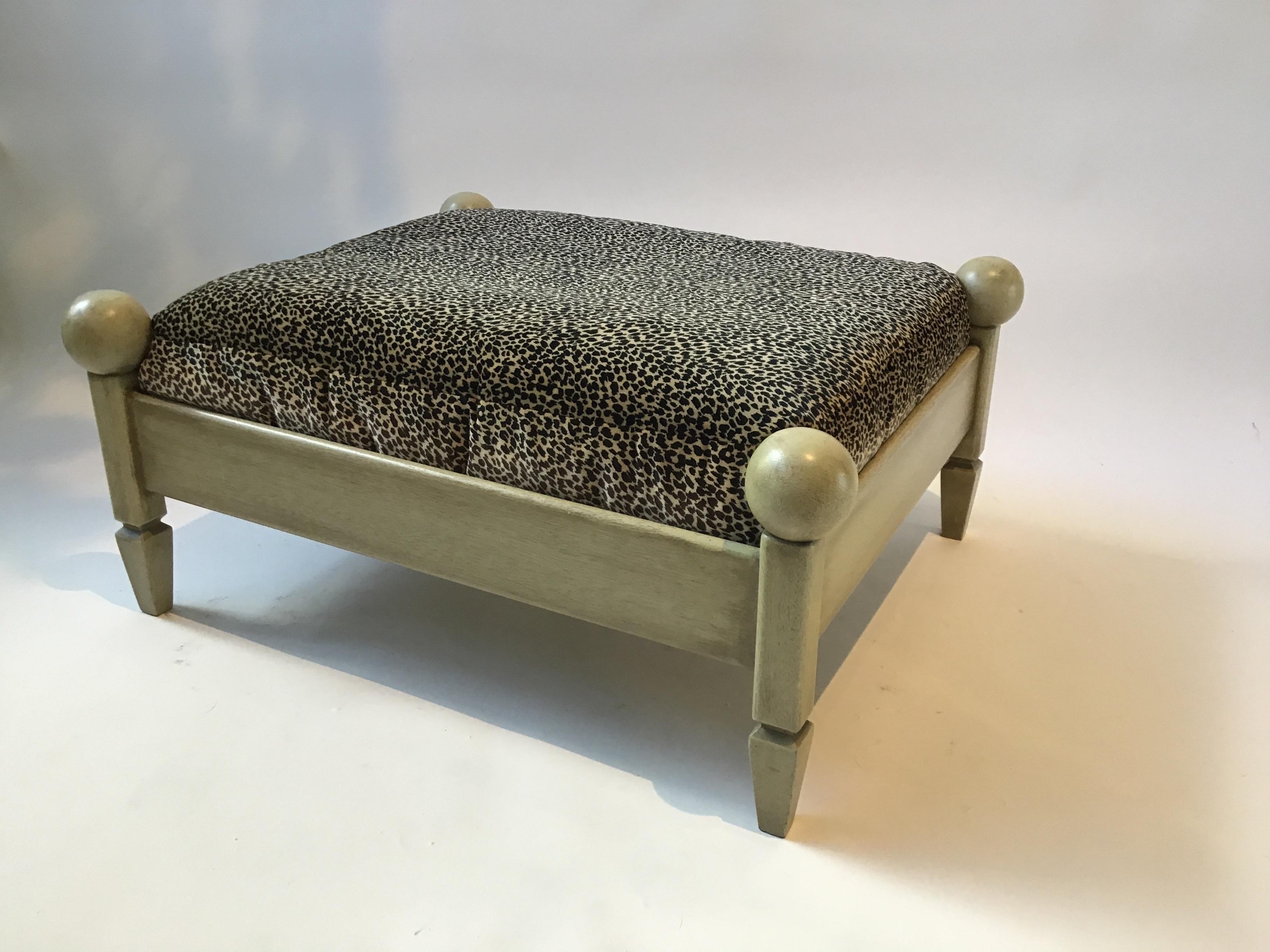 Classical wood dog bed. Fading from sun to cushion fabric.