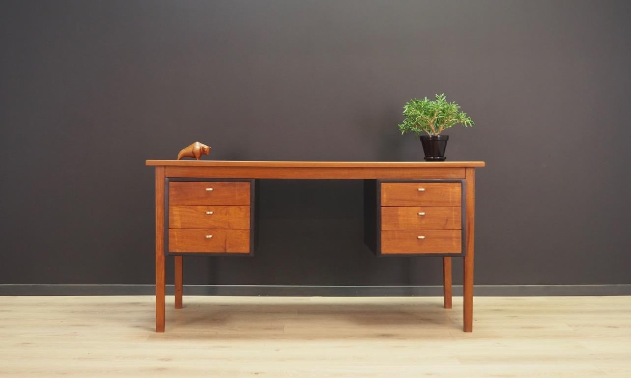 Writing desk from the 1960s-1970s, Minimalist Danish design, perfect in every detail. Form veneered with teak. Desk has six drawers, and on the back there are bookshelves. Preserved in good condition (small bruises and scratches, filled veneer