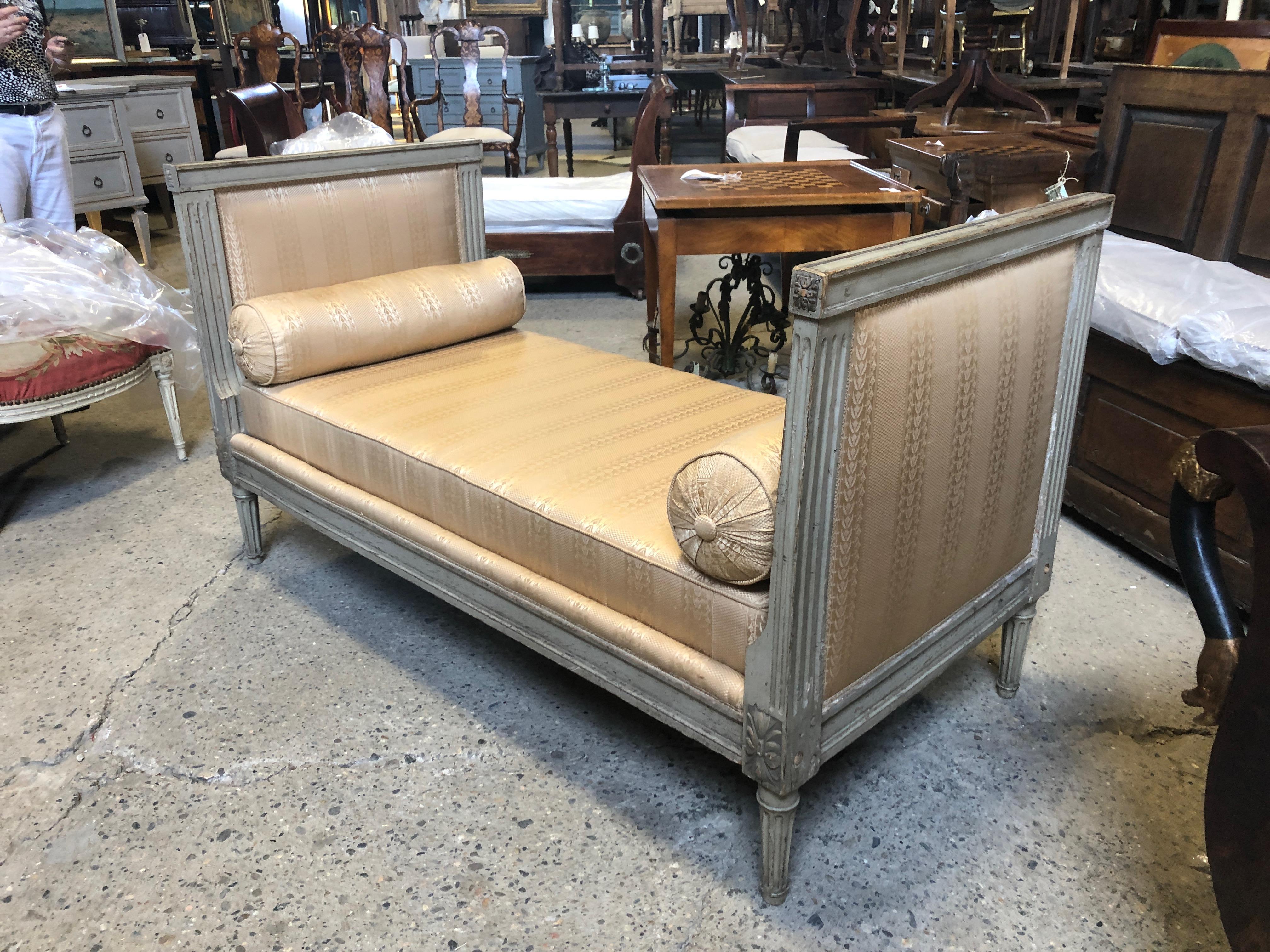 Gorgeous grey painted carved wood French antique daybed with glamorous yellow striped silk upholstery and two lumbar pillows. Cushion 57.75 W.
#2232