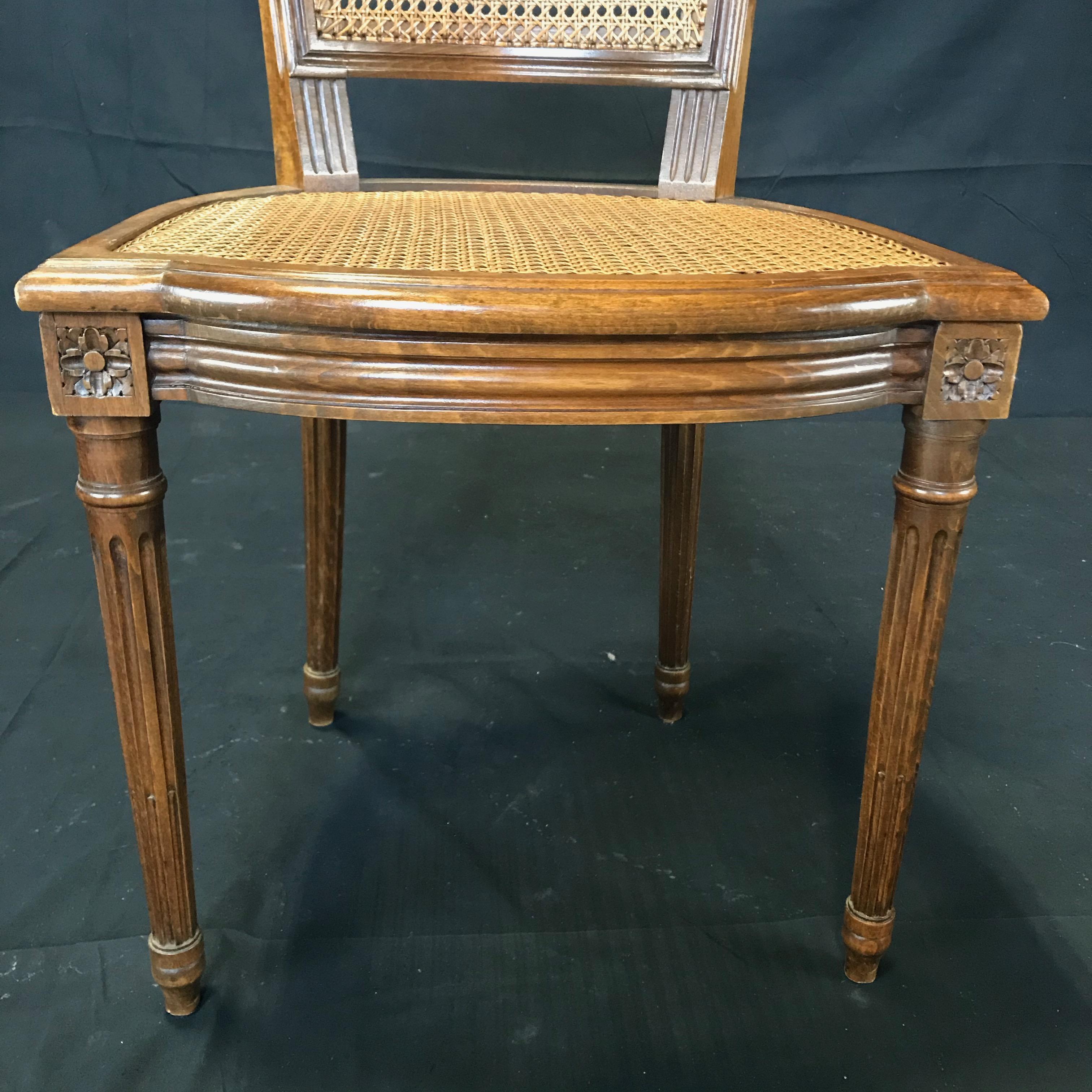 Mid-20th Century Classically Beautiful Set of 4 French Louis XVI Walnut and Caned Dining Chairs