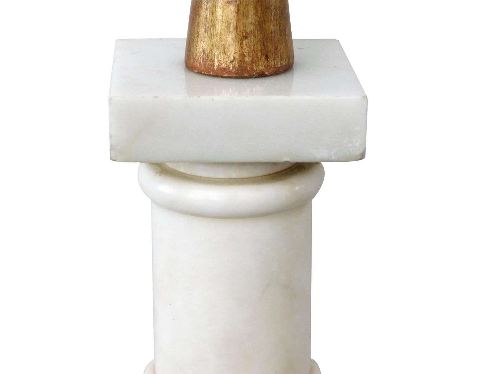 with giltwood neck above a turned columnar body of nicely figured Carrara marble all over a giltwood base
