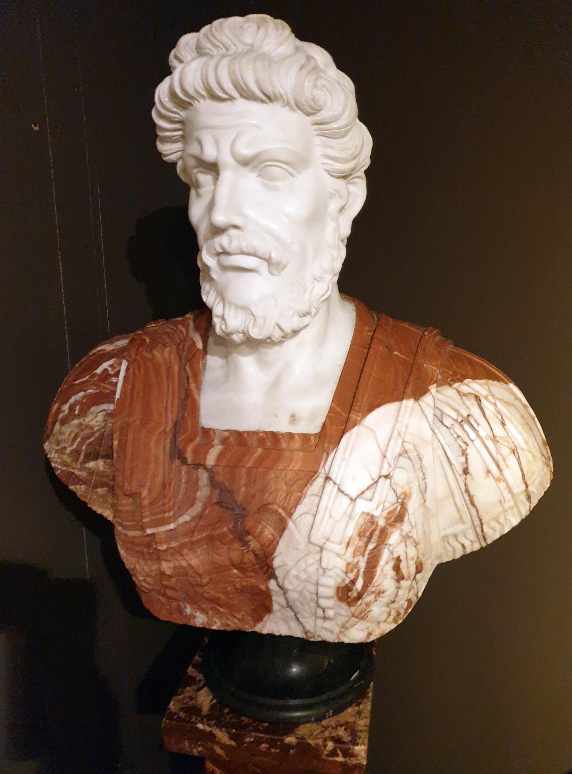 Elaborately crafted classicism bust of a Roman or Greek philosopher in marble and alabaster. The representative bust is handcrafted in various types of marble and stone. Mid-20th century.