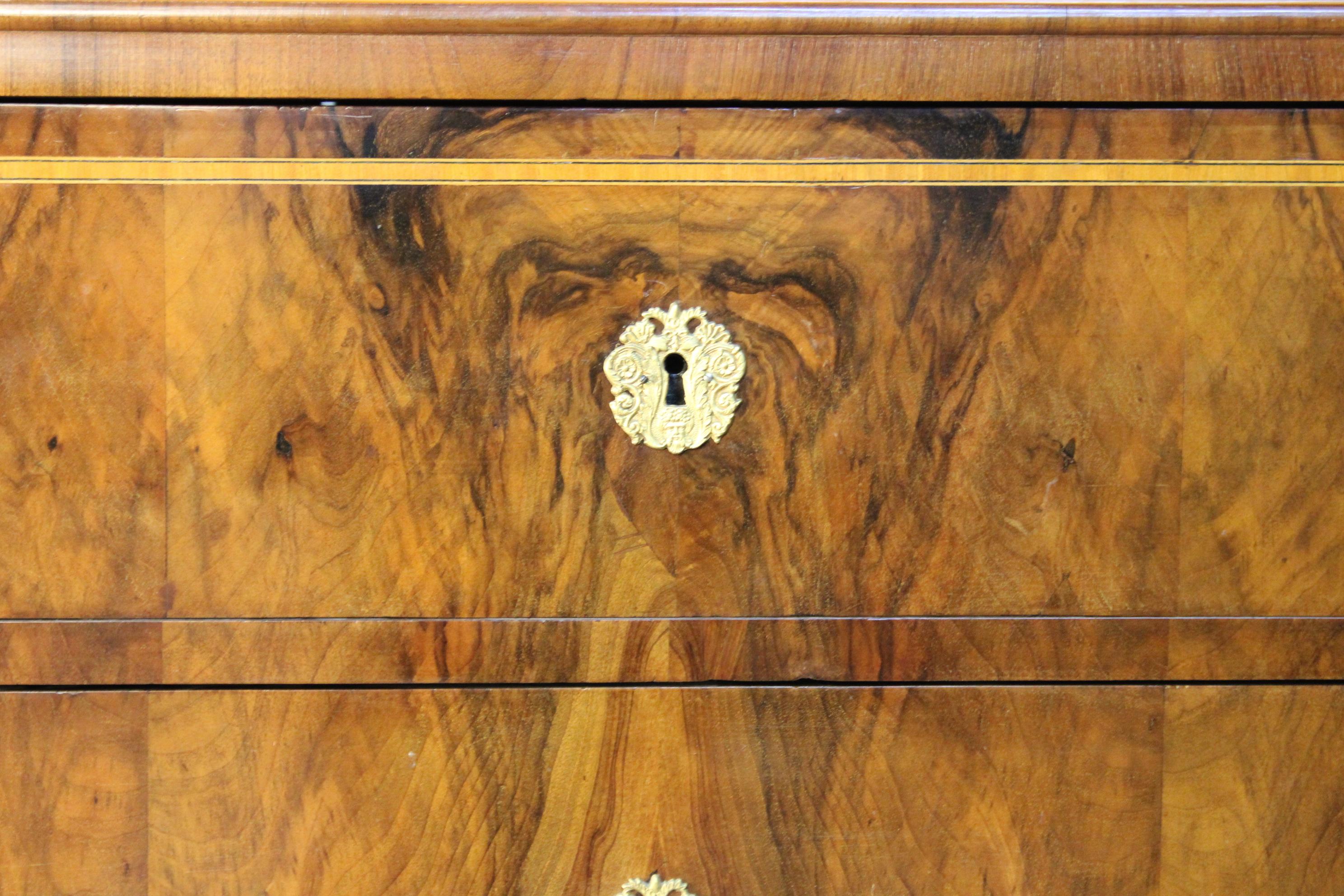 Remarkable Classicism chest of drawers from the late 18th century, the so called Josephinism period - the smooth transition from the Baroque to Biedmeier.
Enriched with great nut wood and burl veneer, this eye catching chest of drawers coms with