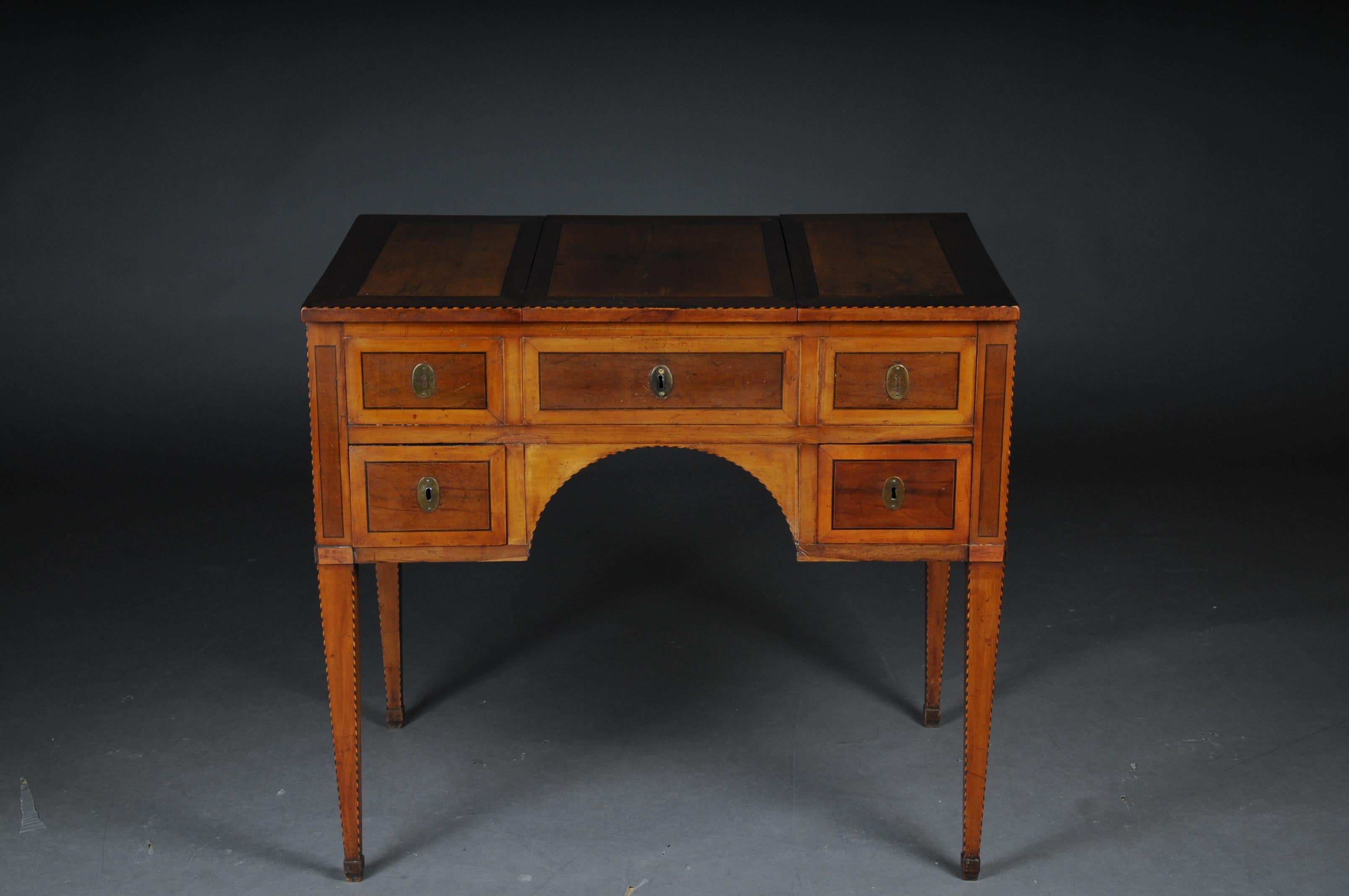 Antique classic dressing table made of different fruit trees. Inlaid thread edge.
Rectangular panel 5 front drawers, on four-cornered, down-tapering legs. Dressing table, so-called Poudreuse, southern Germany, circa 1790, 5 drawers, hinged at the