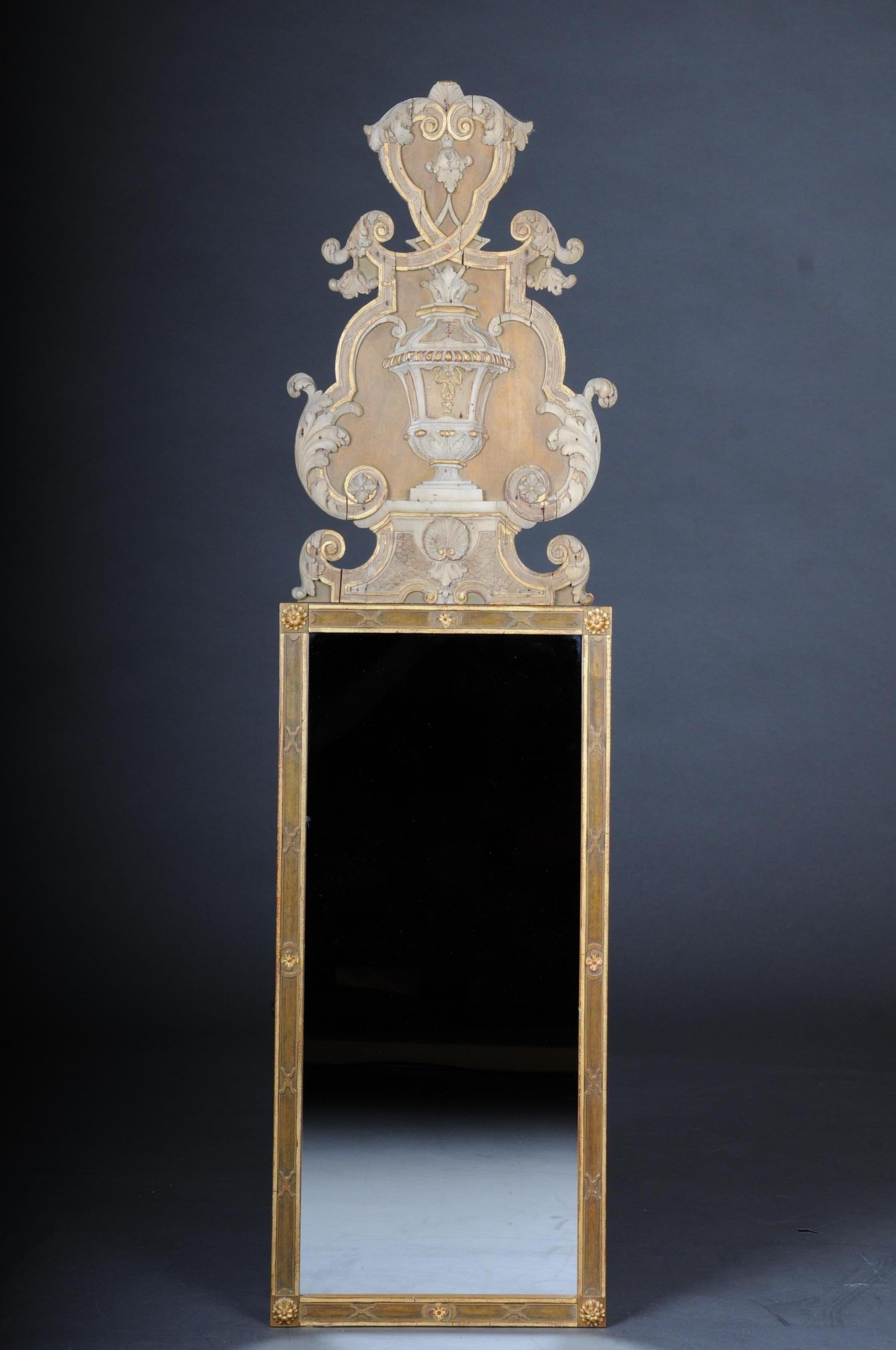 Classicism wall mirror, colored 19th century

Carved solid wood. Classicism mirror, gold-plated and colored. 
Rich and high ornate crown. Extremely decorative and splendid.

(M-53).