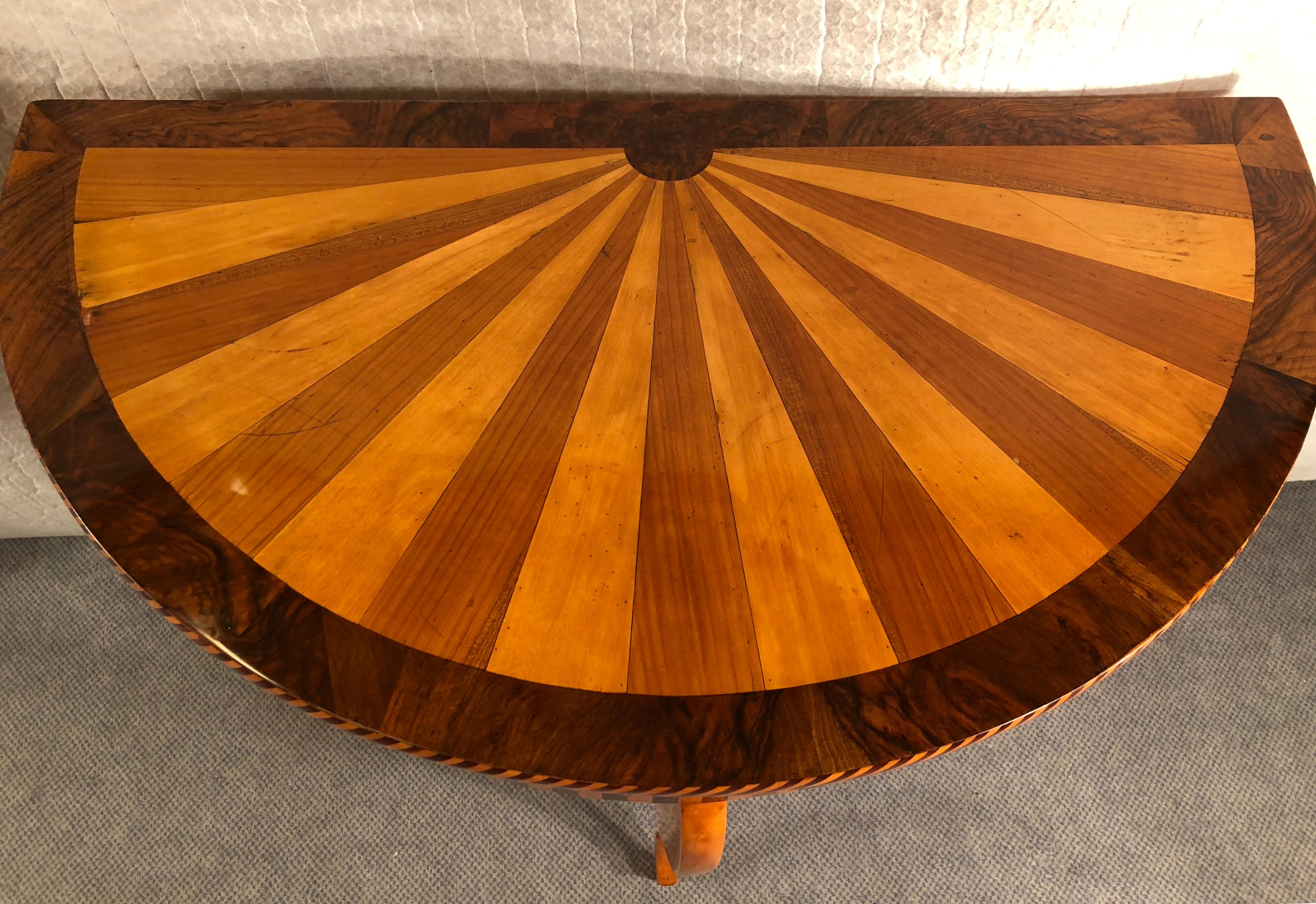 Unique Art Deco demi-lune table, Germany, circa 1900-20, beautiful marquetry in walnut, cherry, mahogany and elm. In good condition, French polished.