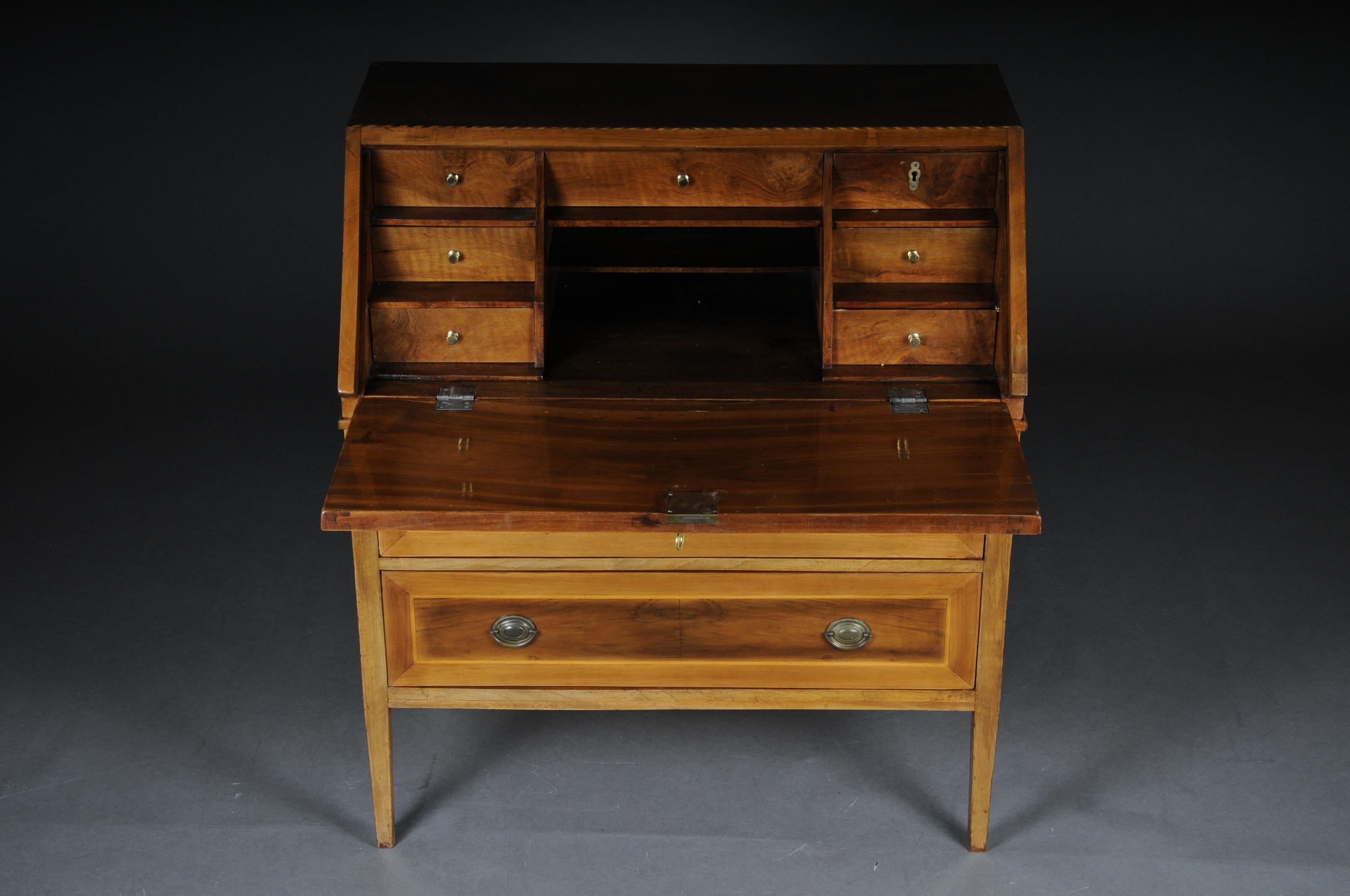Classicist/Empire clapperboard secretary, circa 1790

Solid wood veneered with walnut. High-quality top on short tapered square legs, straight two-tier body, sloping writing flap above and staggered office division from drawers. Framed with thread
