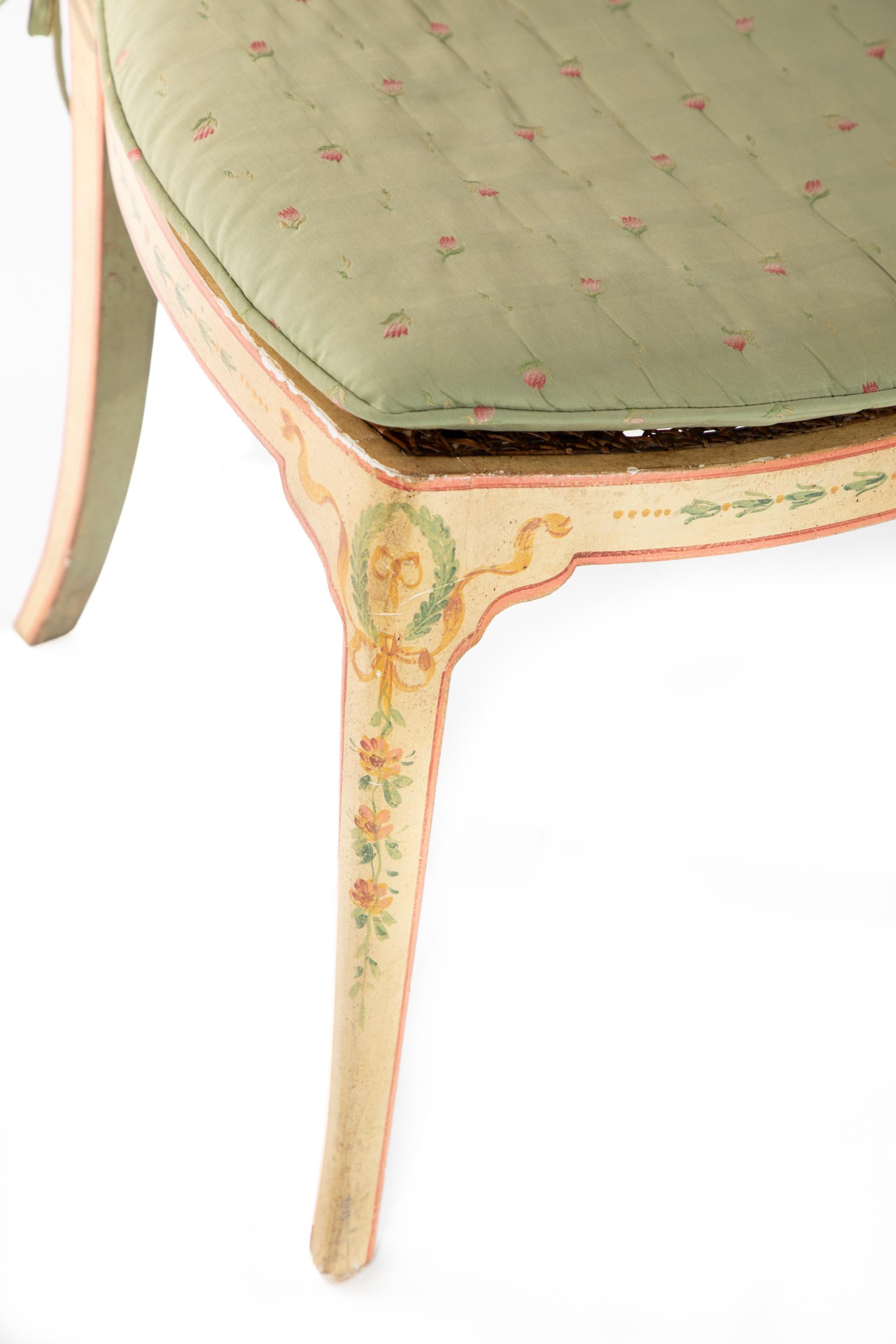 Classico style wooden chair by Patina.  Hand painted with flowers and vine designs.
Caned seat and upholstered cushion.
