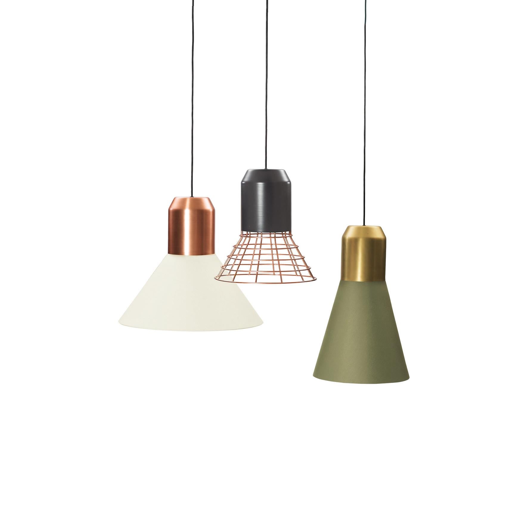 Sebastian Herkner’s bell lights reveal their adaptability and flexibility at the very first glance. Each of the lampshades in this family of pendant lamps can be combined with a choice of sleek cylindrical bulb sockets in grey, brass or copper and