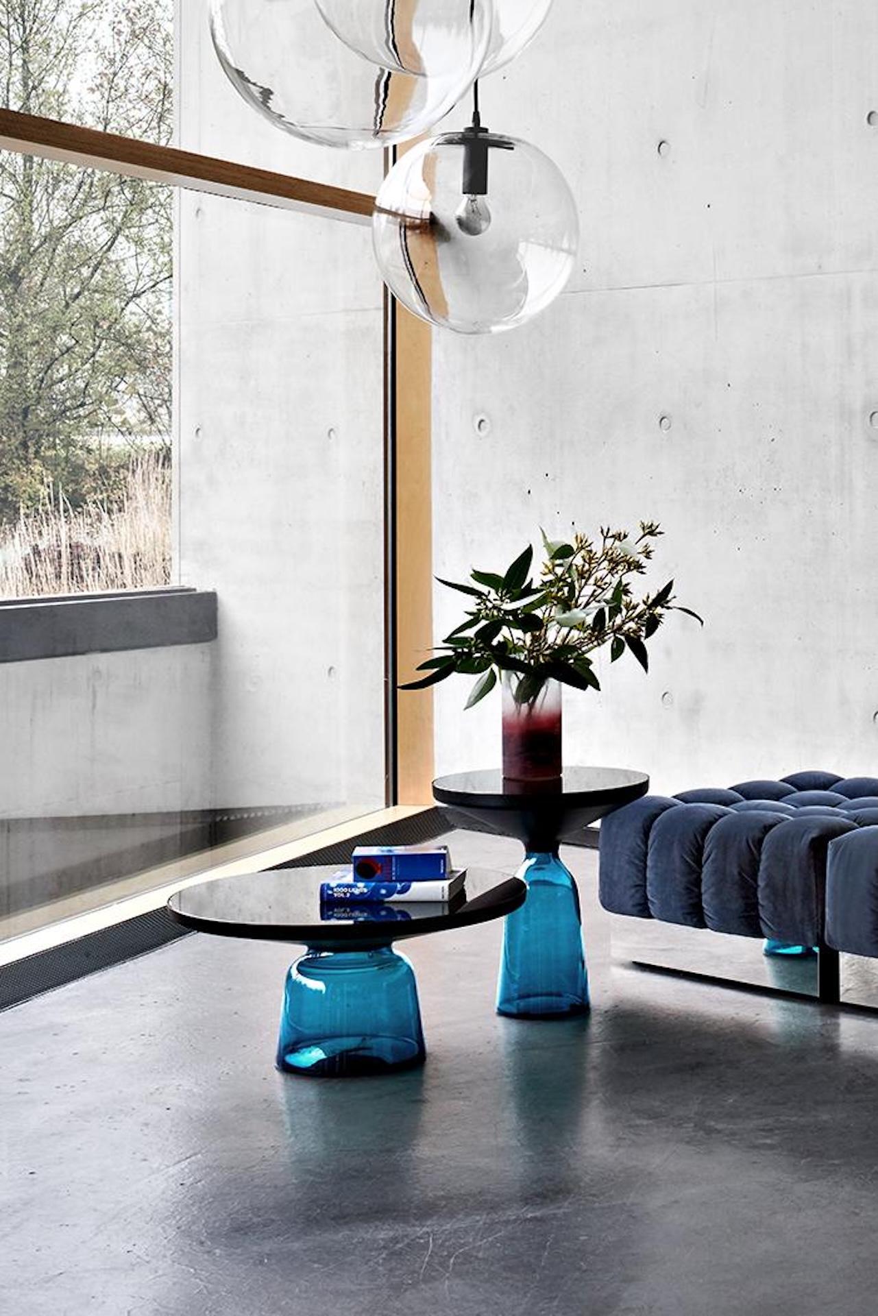 in STOCK

The bell table by Sebastian Herkner turns our perceptual habits on their head, using the lightweight, fragile material of glass as base for a metal top that seems to float above it. Hand blown in the traditional manner using a wooden mold,