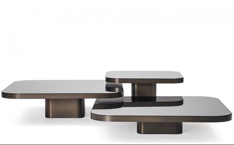 Inspired by 1970s lines and designs, Brazilian Guilherme Torres presents a side table or coffee table of casual elegance. The metal-covered surface of the body also quotes futuristic designs of the era, but it is a clearly contemporary design. The